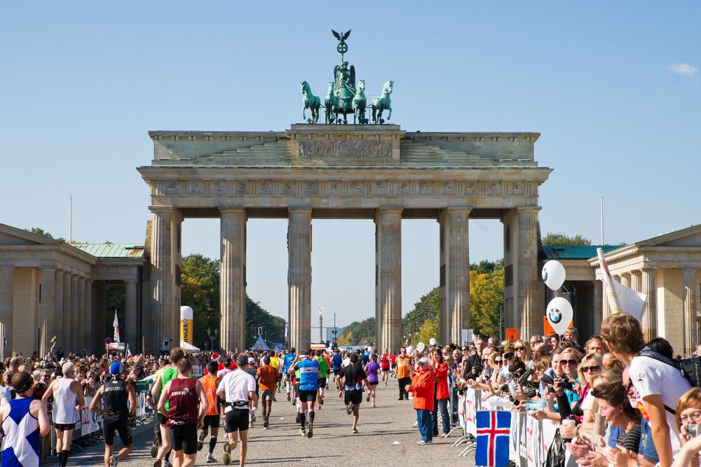 BERLIN, GERMANY - SEPTEMBER 25: Participants of the Berlin Marathon finishing at the Brandenburg Gate on Sept. 25, 2011 in Berlin, Germany.