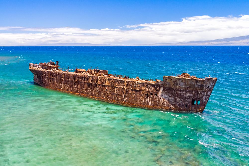 A rusty shipwreck off the coast of ShipWreck Beach on the Island of Lanai