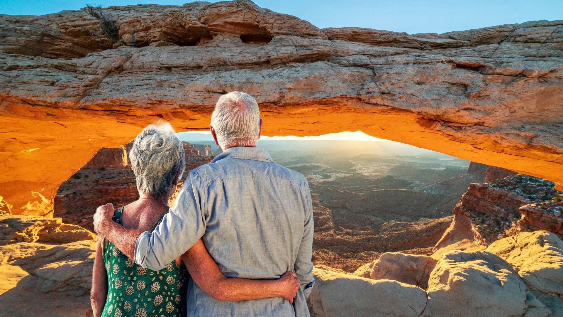 Older couple at Mesa Arch, Canyonlands, UTAH