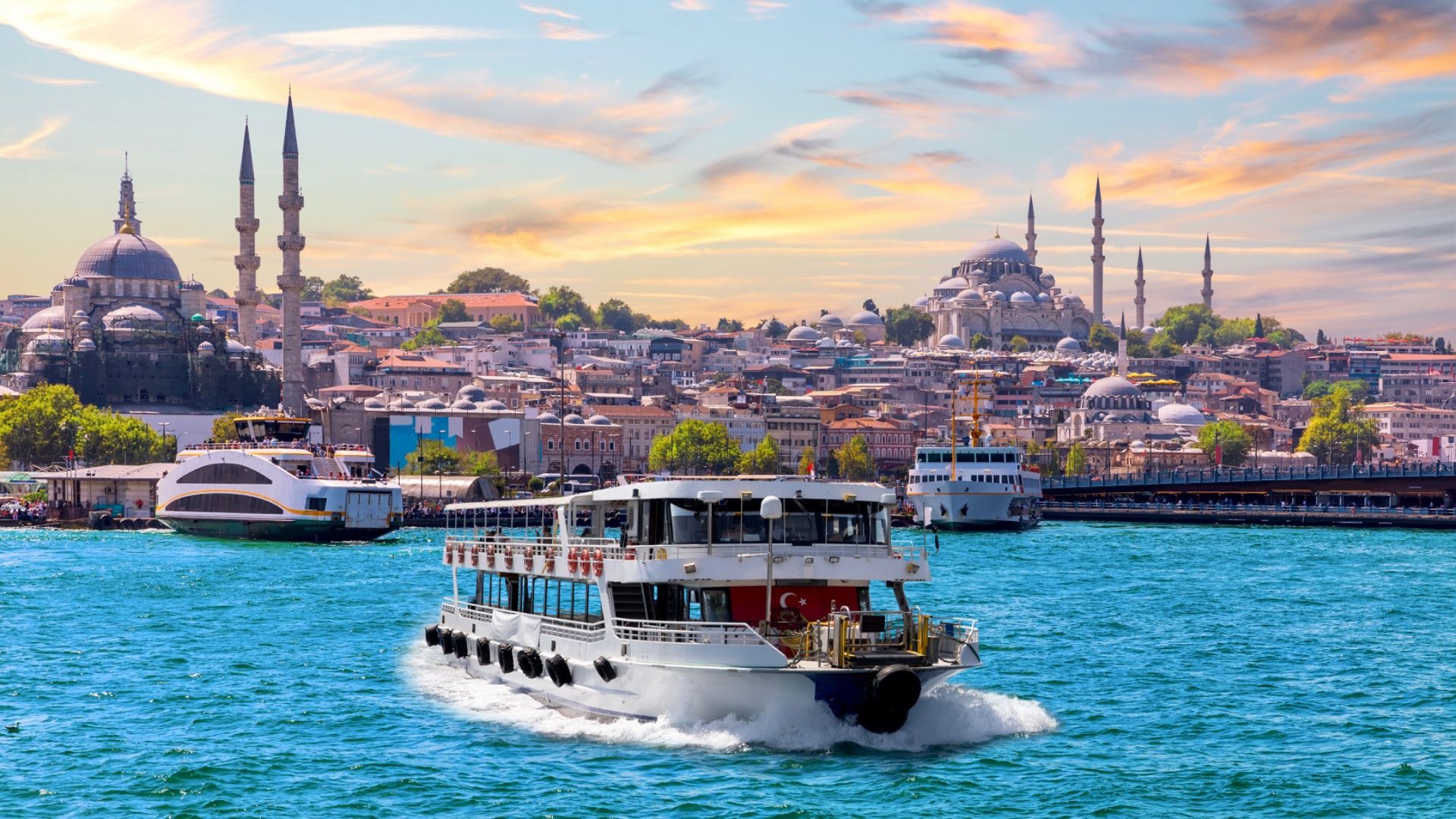 Famous Suleymaniye and Rustem Pasha Mosques and the cruise boat on the Bosphorus