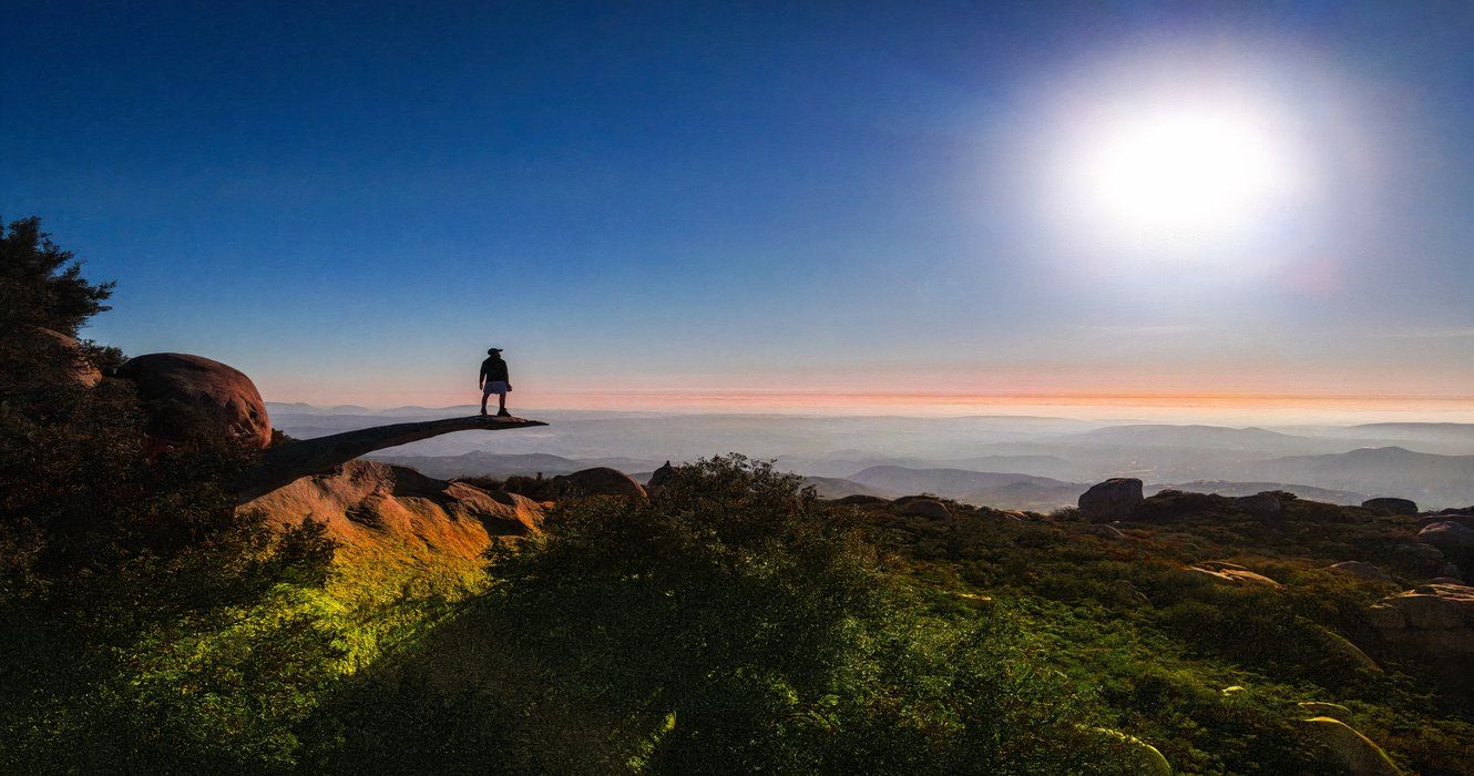 A hiker on Potato Chip Rock, CA, California, USA