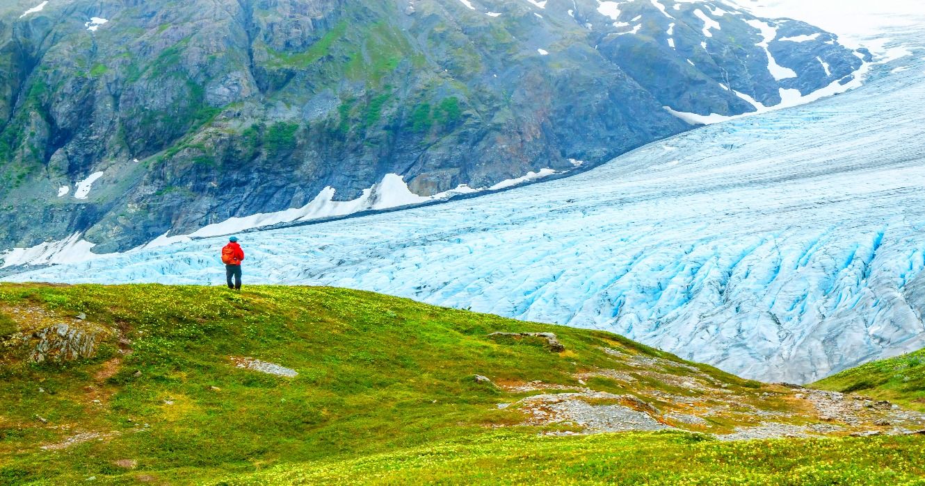 A person hiking in Alaska by the Exit Glacier in Kenai Fjords National Park, AK, Alaska, USA