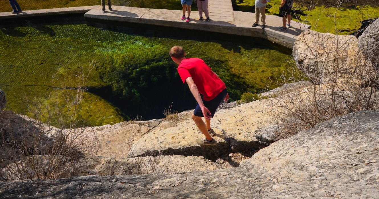 Hiker at Jacob’s Well in Wimberley, Texas, TX, USA