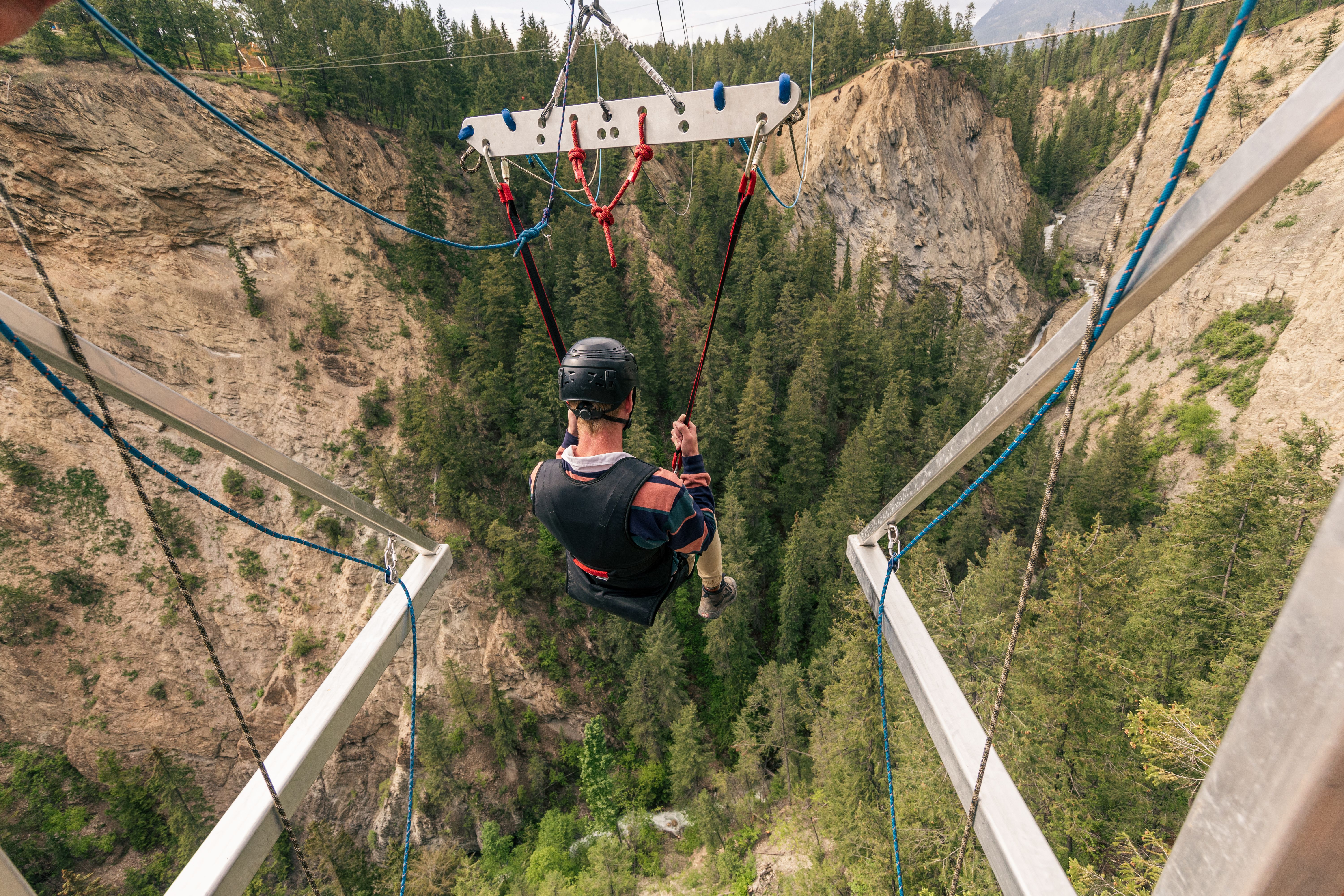 Giant Canyon Swing with skybridge in the background.