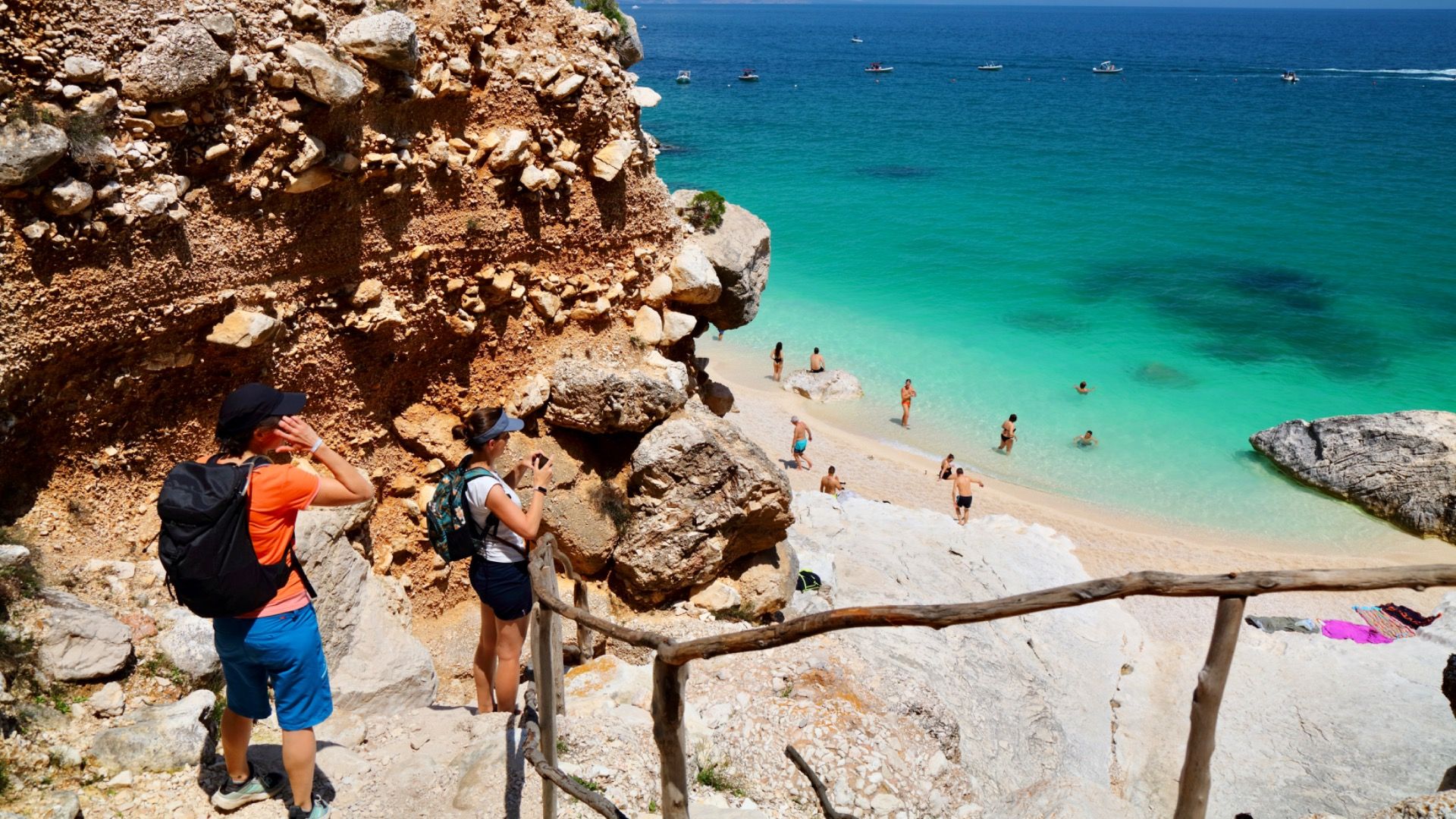 Tourists hike down to Cala Goloritze beach in Baunei