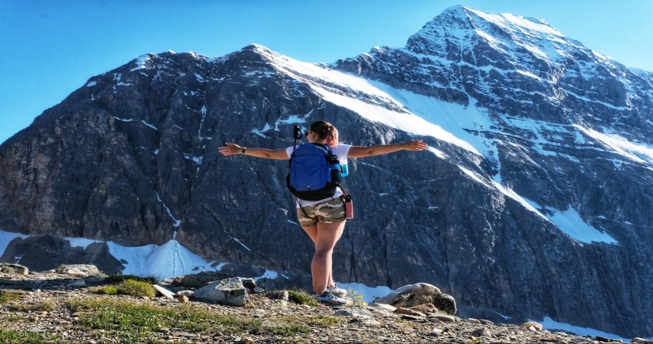 Hiker at Mt Edith Cavell and Angel Glacier in Jasper National Park, Alberta, Canada