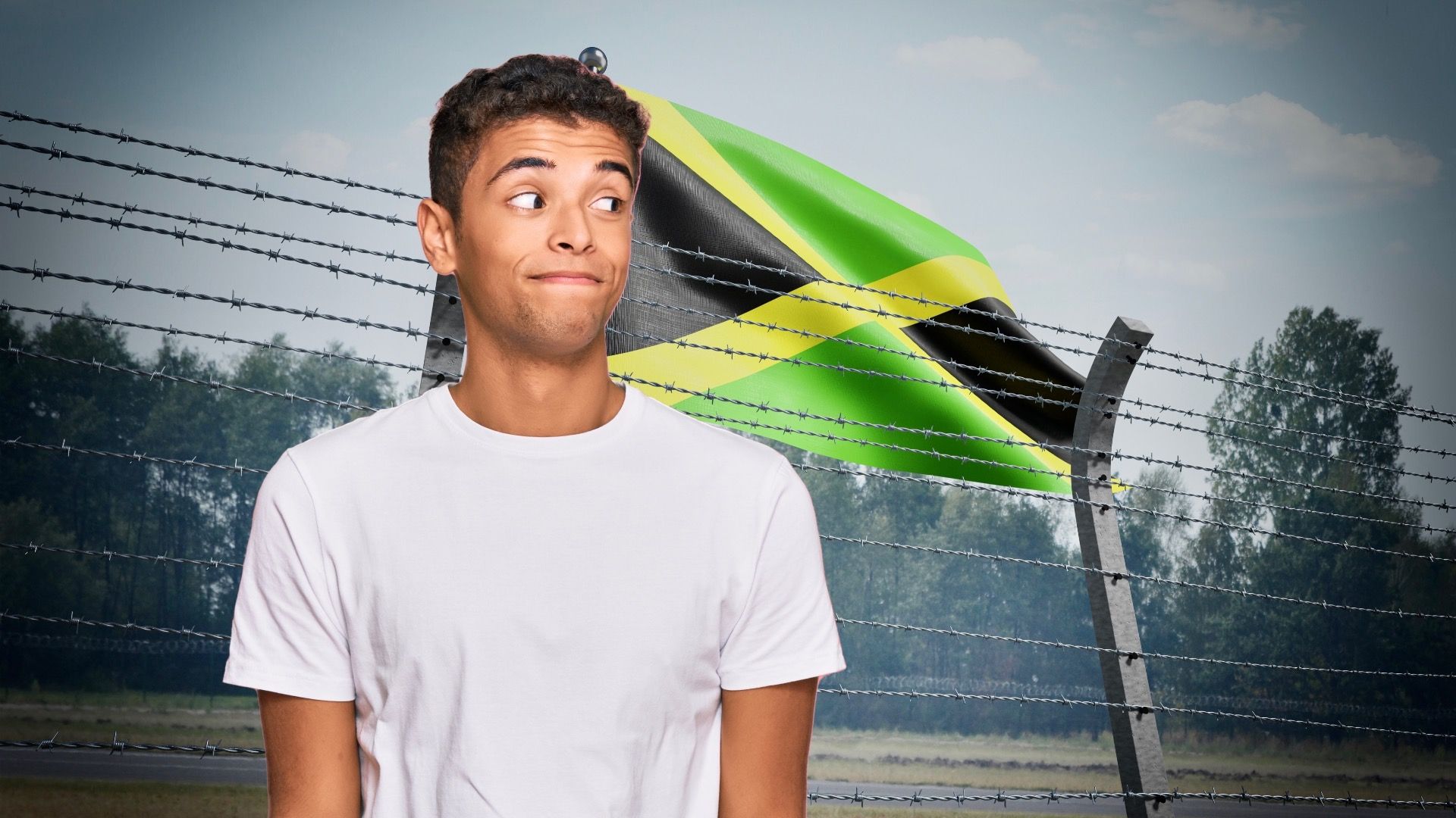 Barbed wire fence and flag of Jamaica