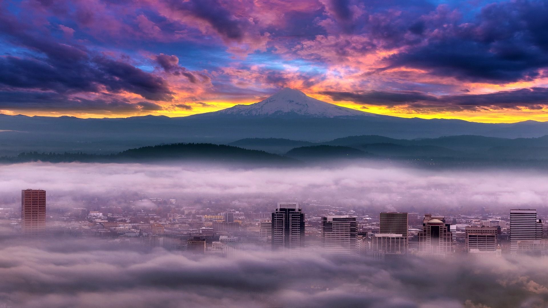 Sunrise over Mount Hood, OR, Oregon, USA, with foggy Portland seen below