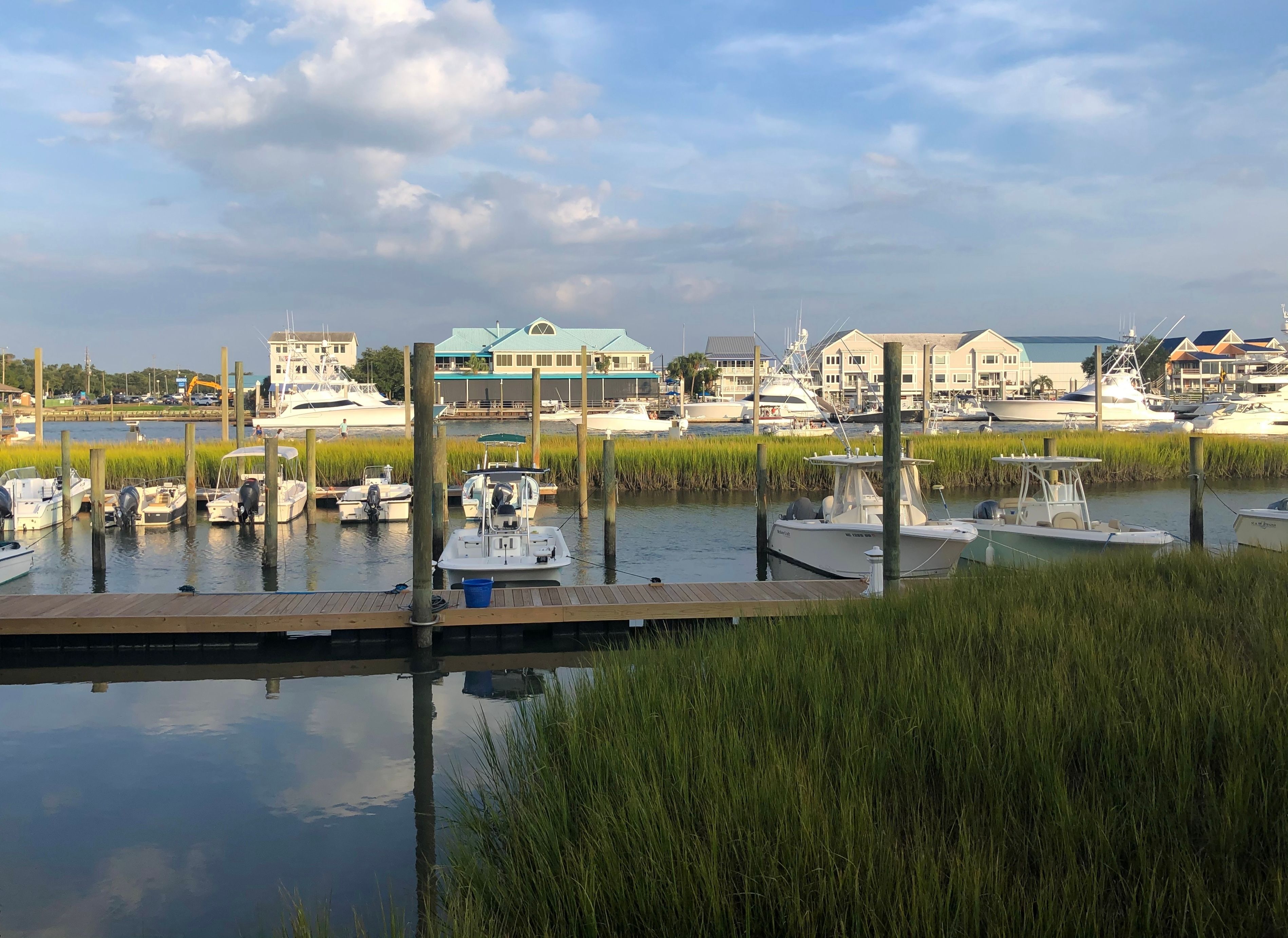 Boats and homes along the dock in Ocean Isle NC