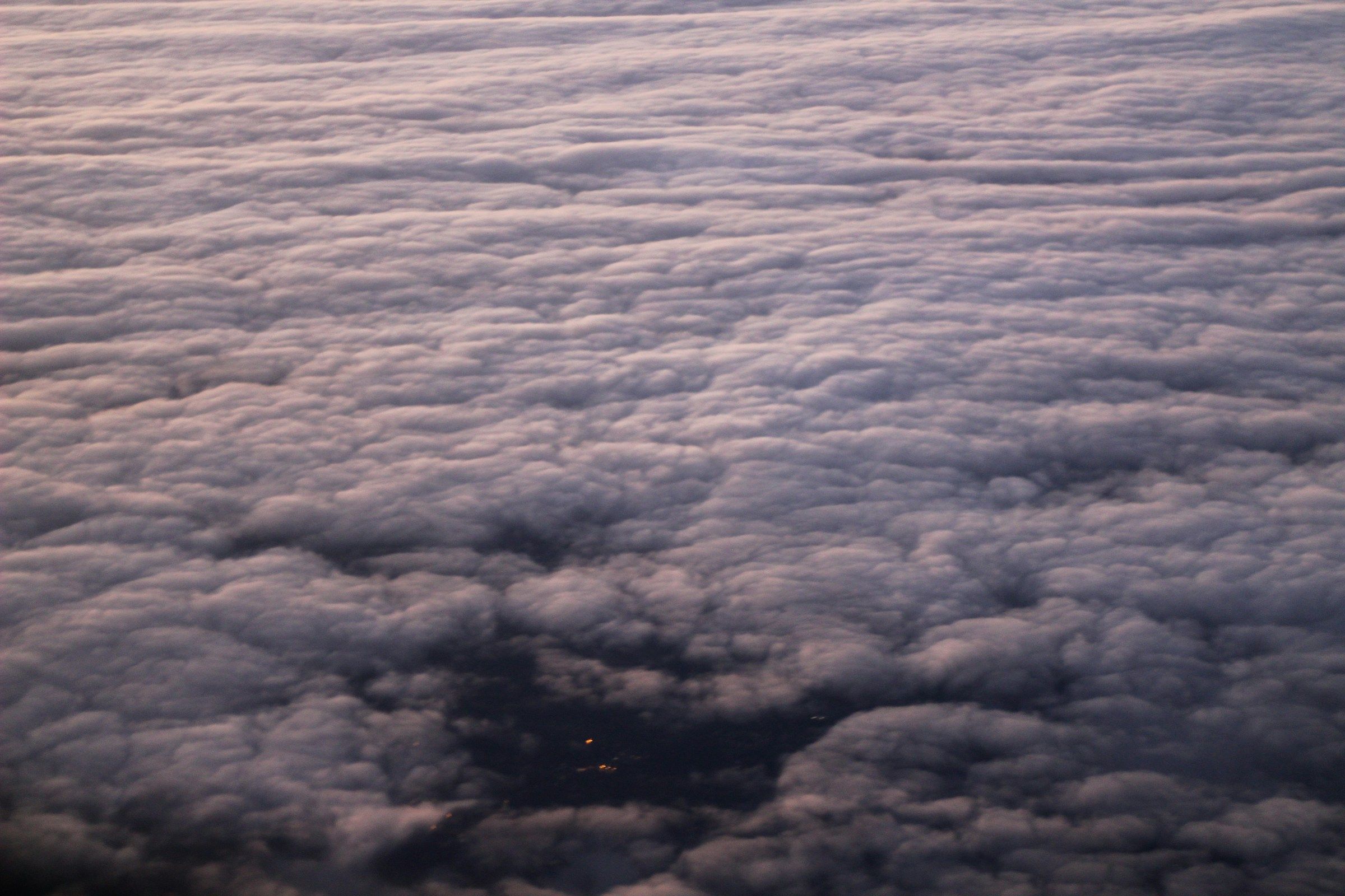 View of clouds and a city from 30,000 feet