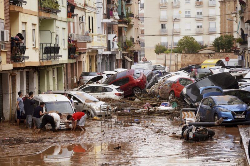 Cars stacked atop one another in Valencia region of Spain after major flash floods - Image credit La Presse