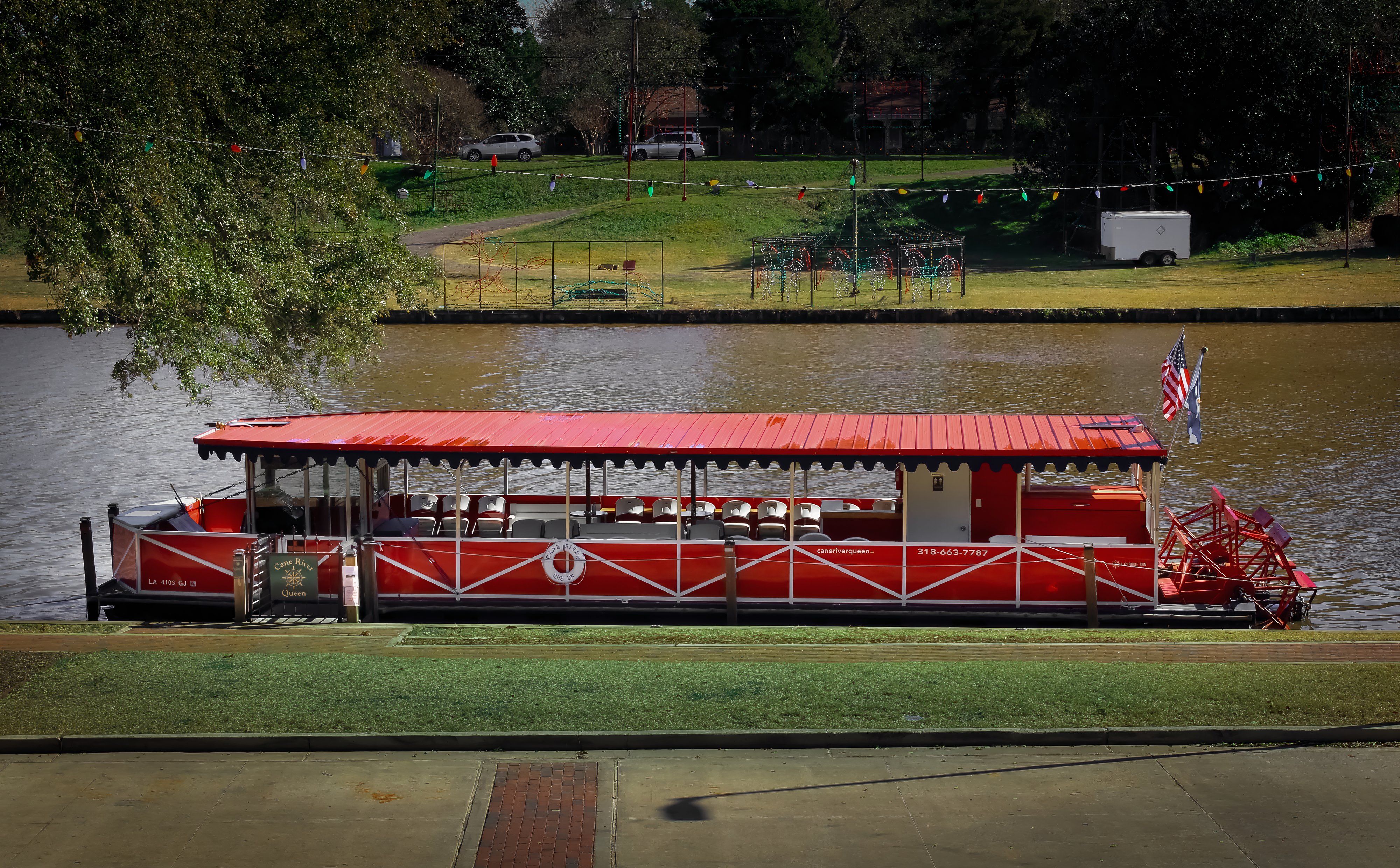 Natchitoches, Louisiana United States - December 24 2020: a boat on the Cane River below the town strip