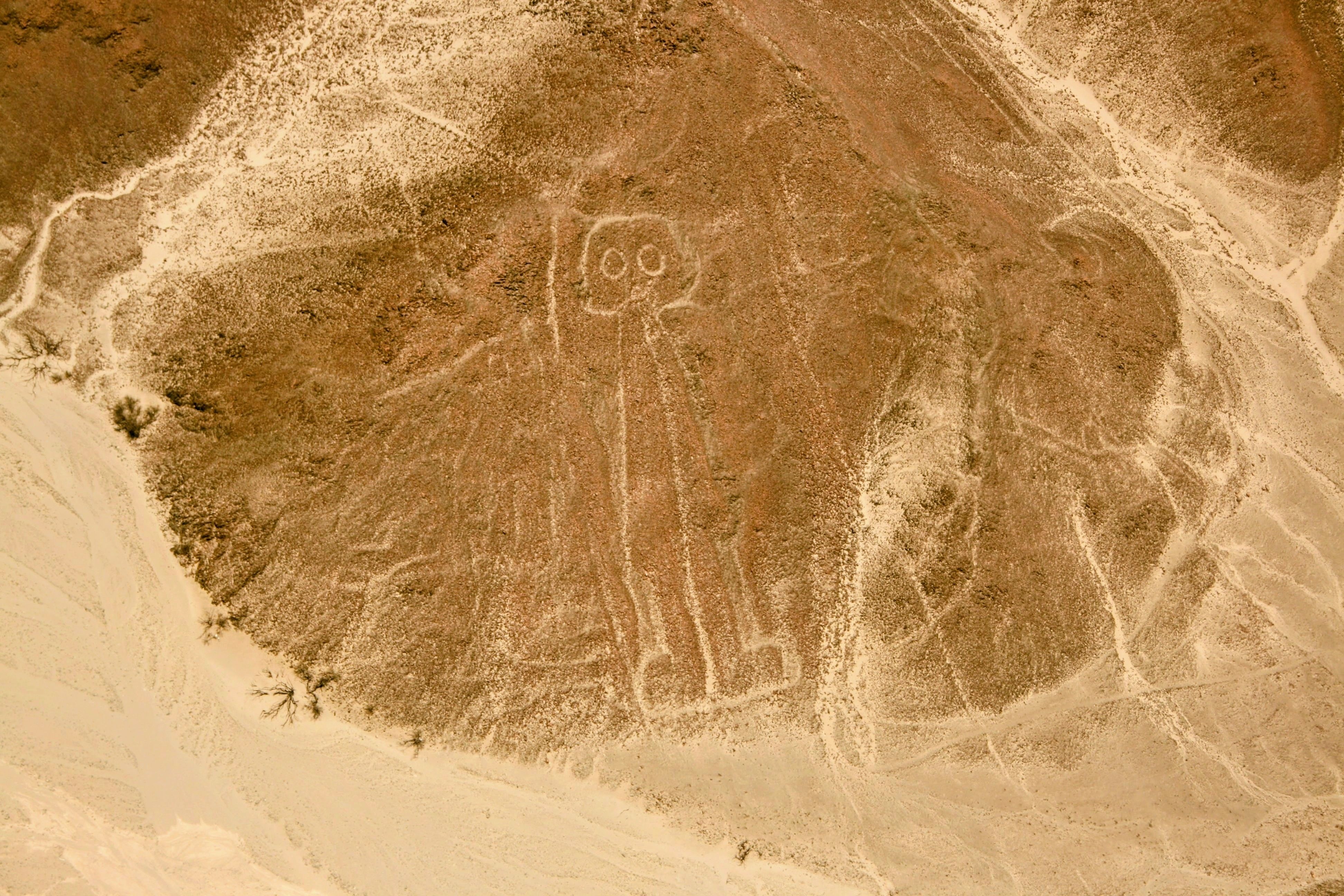 An aerial shot capturing the enigmatic figure in Nazca