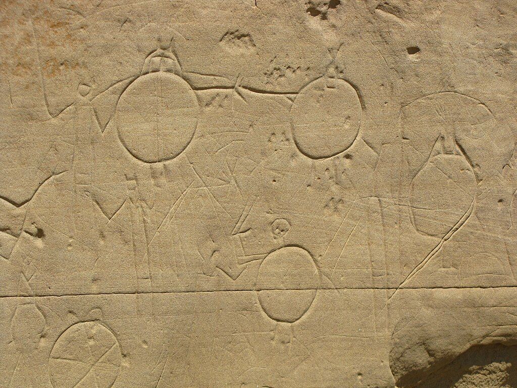 Petroglyphs of men with shields