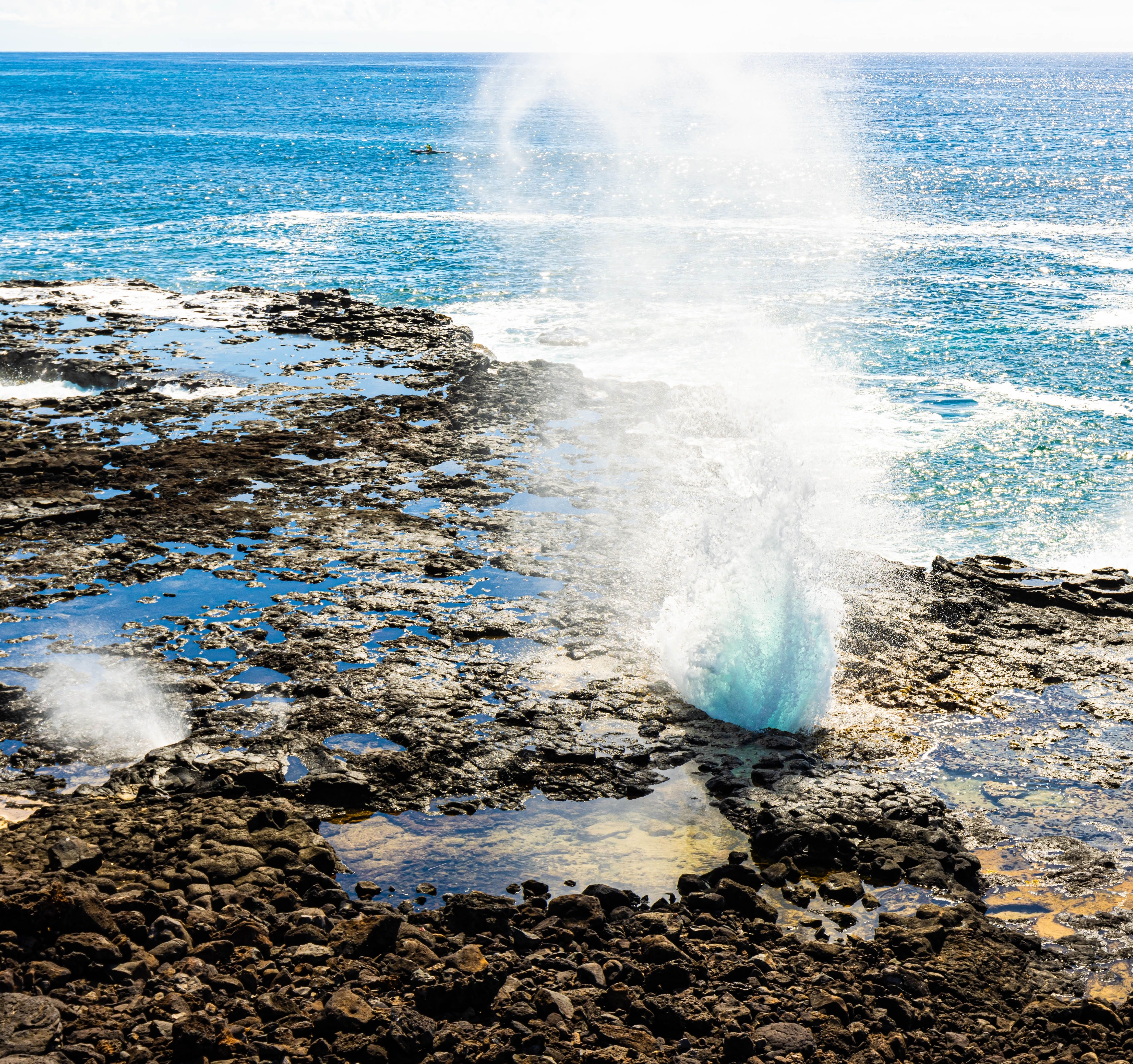 Spouting Horn Blowhole Gushing Through Open Lava Tube, Spouting Horn Beach Park, Kauai, Hawaii, USA