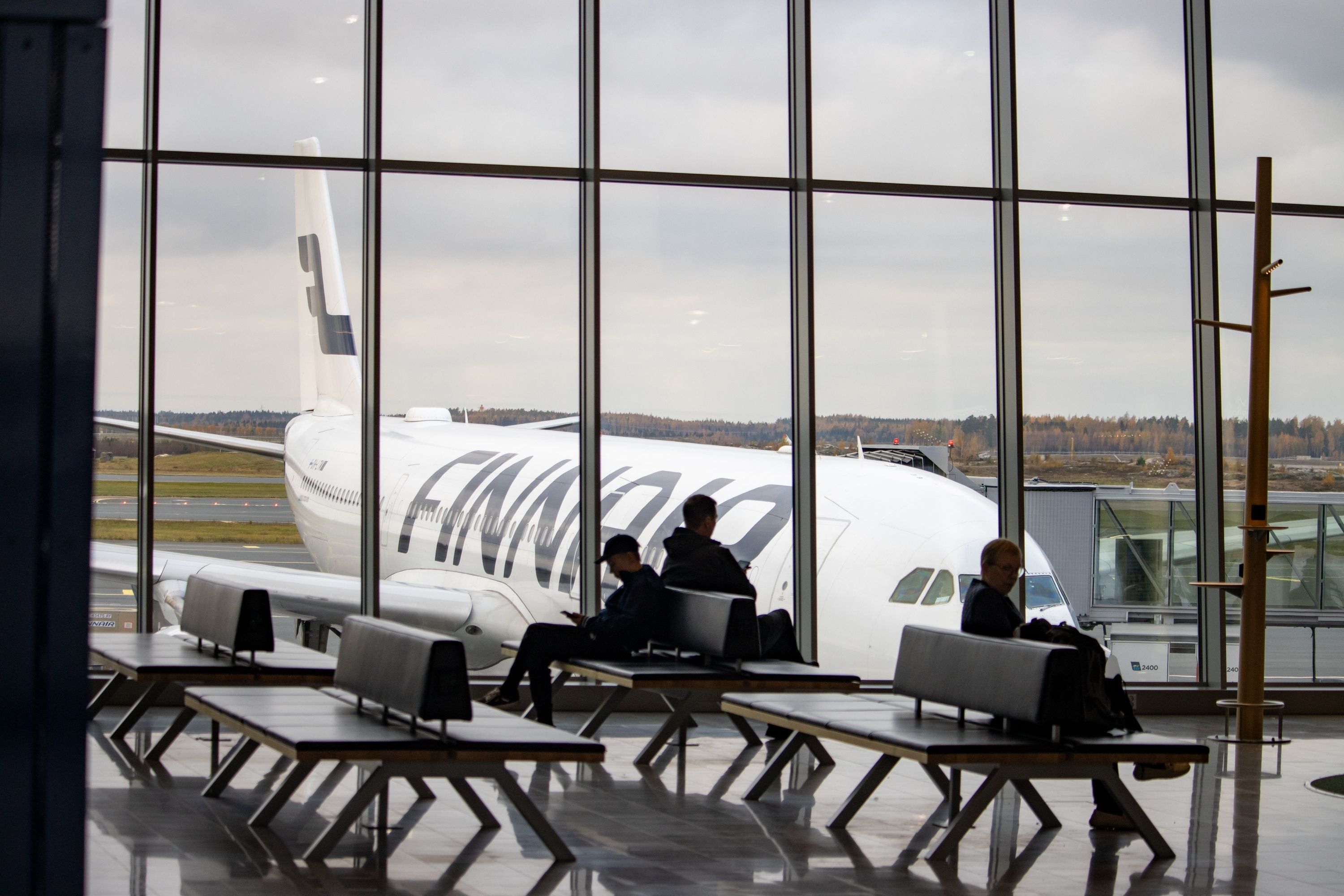 Airport Helsinki-Vantaa, Finland, October 24, 2023 Passengers Waiting Near Finnair Aircraft