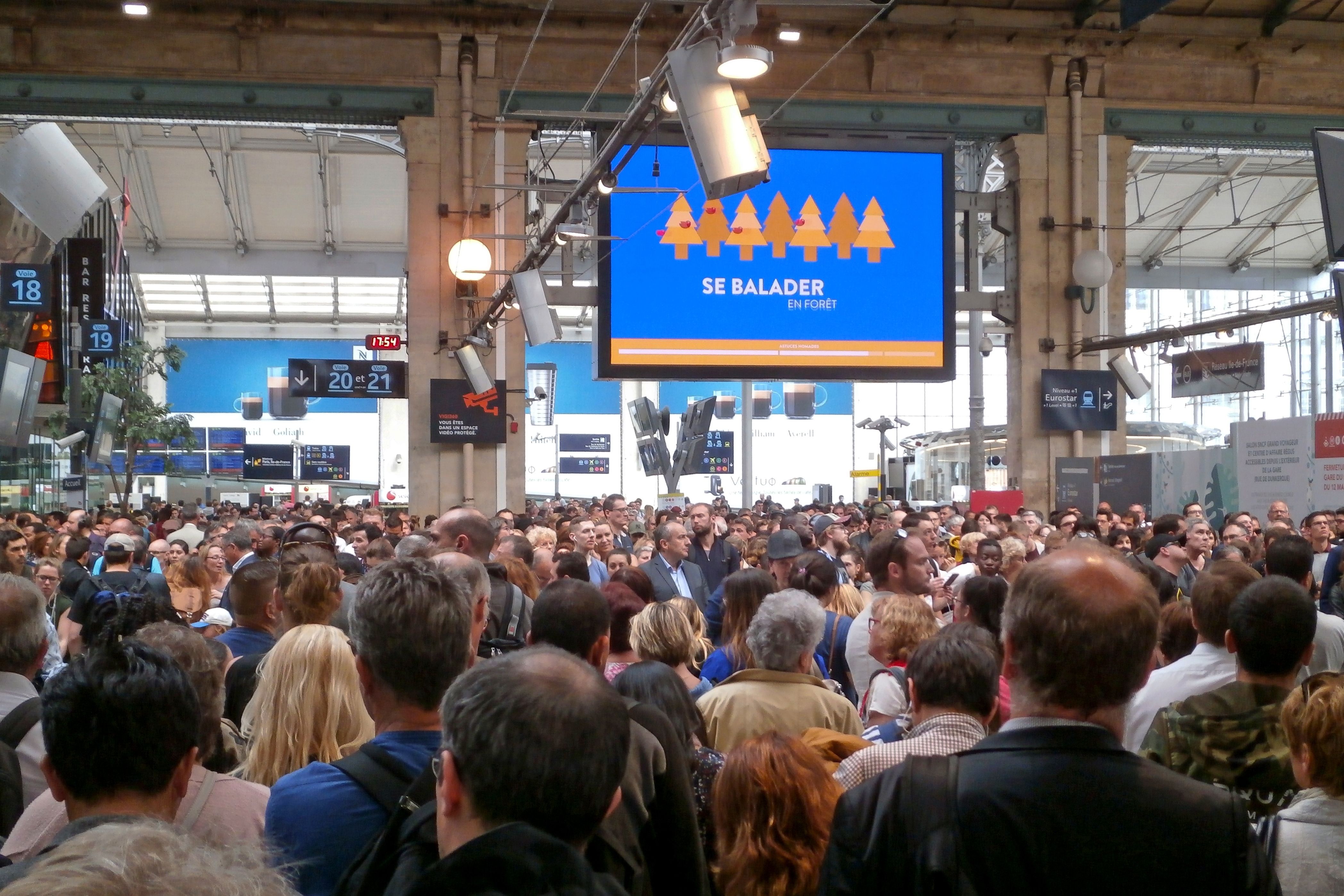 Paris, France - May 25 2018 Thousands of commuters and travellers stuck in Gare du Nord waiting for their trains to arrive during France's rail service strike