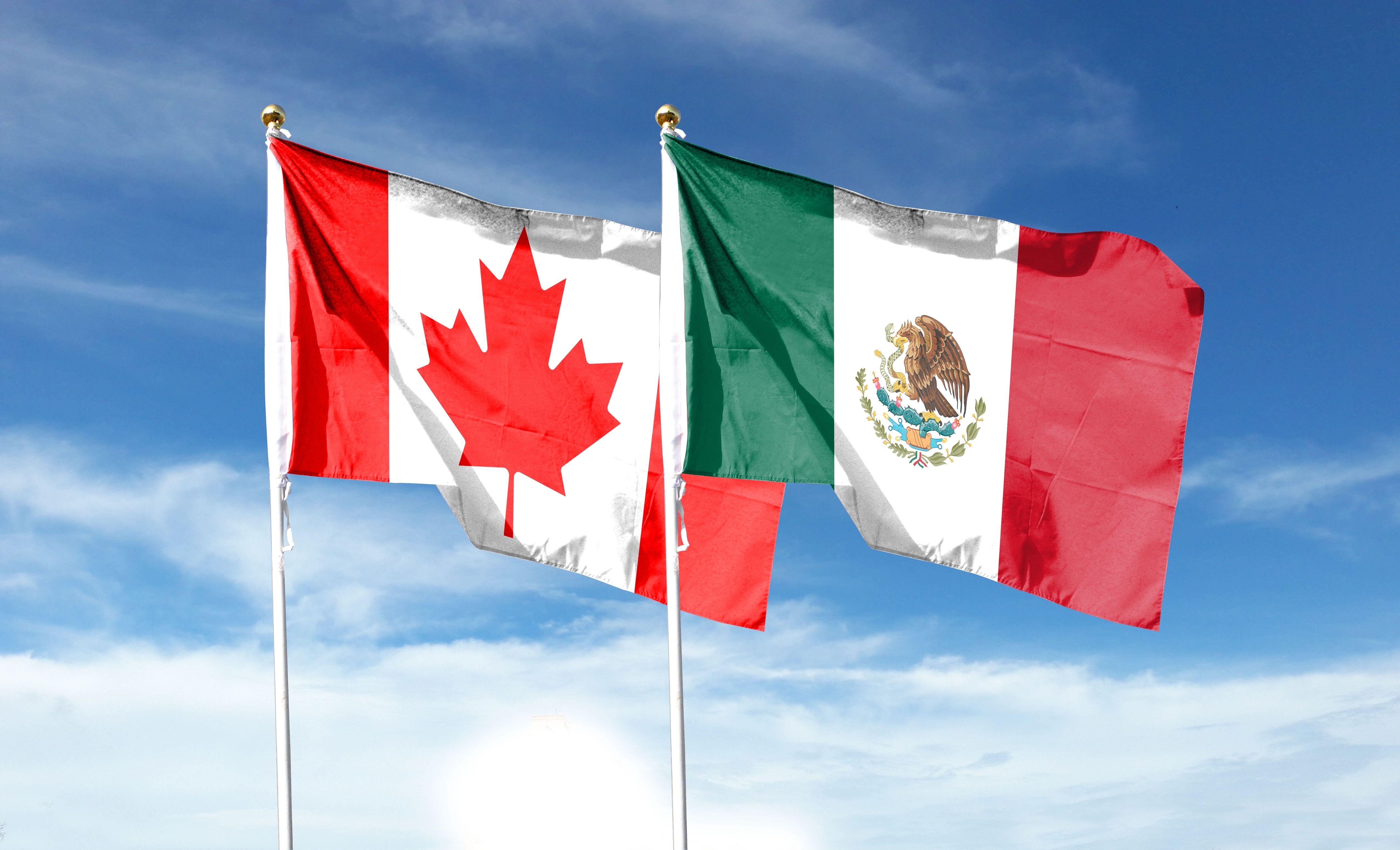 Canadian and Mexican Flags Flying in Unity