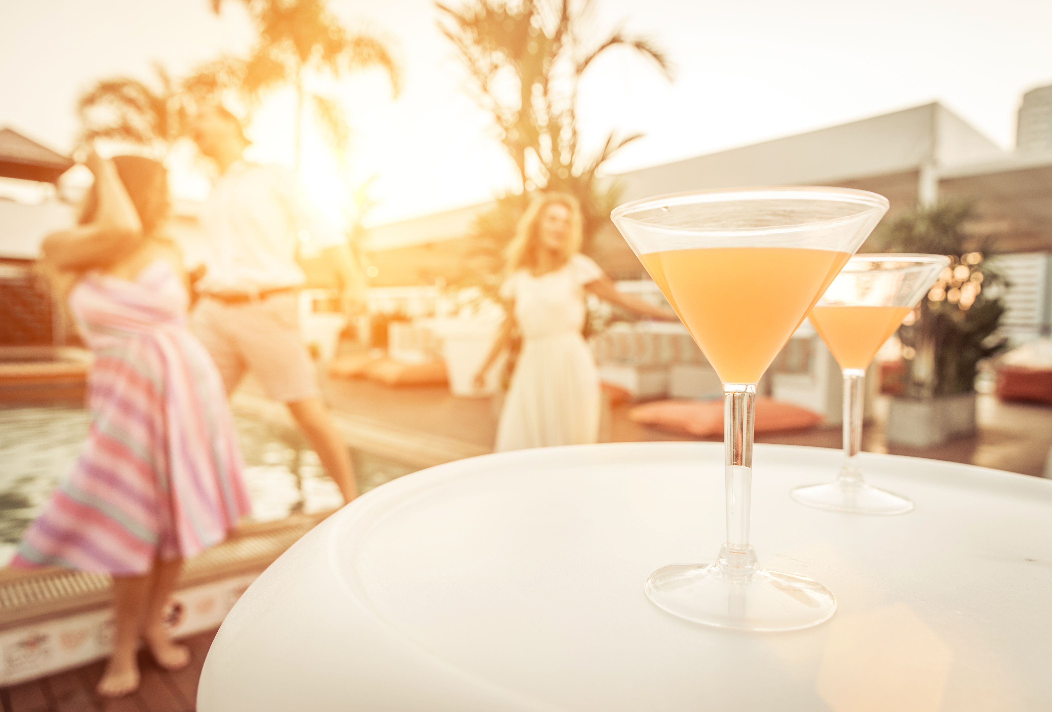 Young people enjoying themselves and having cocktails at a lounge