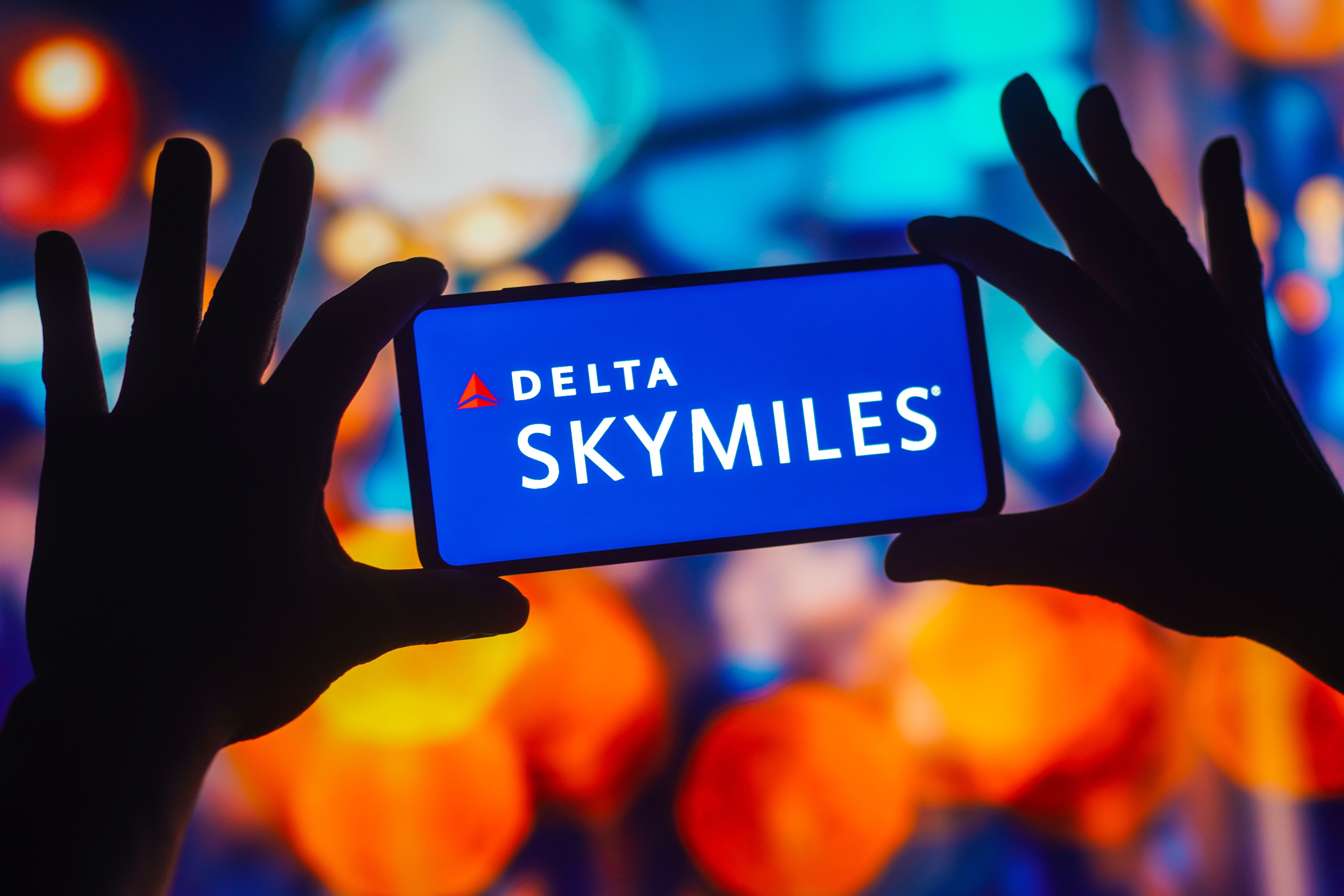 View of Delta SkyMiles logo is displayed on a smartphone screen.