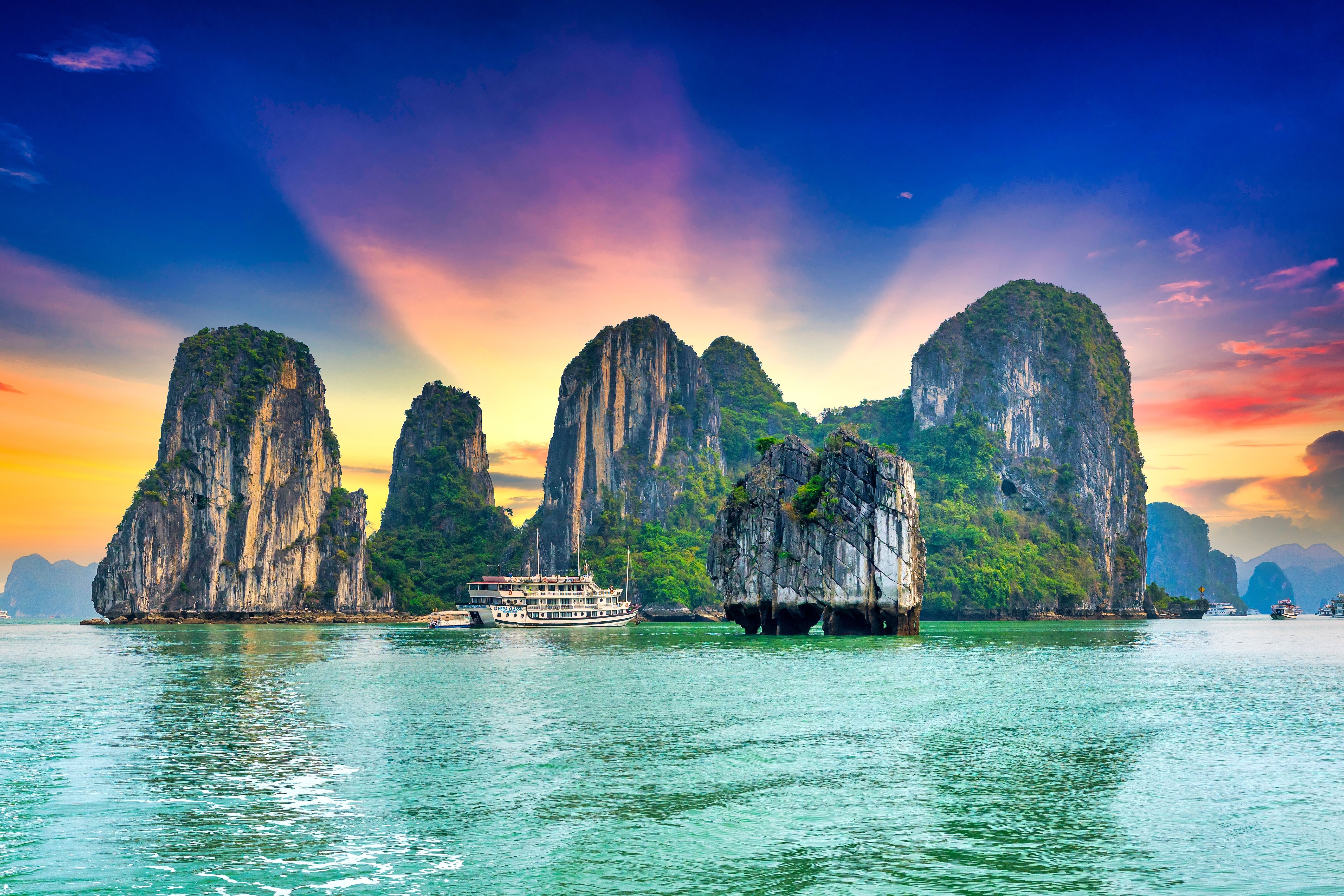 Sunny summer view of limestone cliffs in Halong Bay