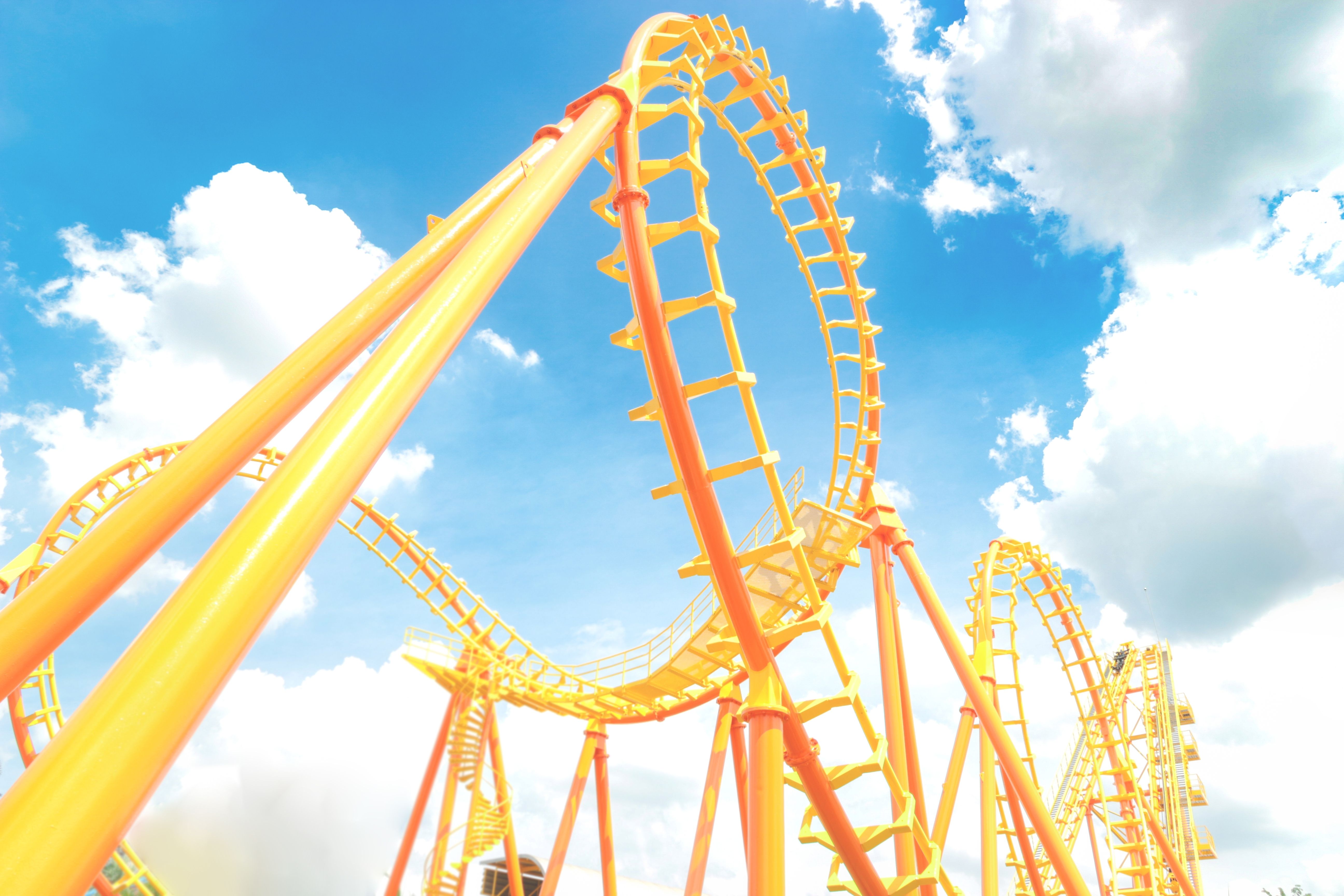 Yellow roller coaster in amusement park
