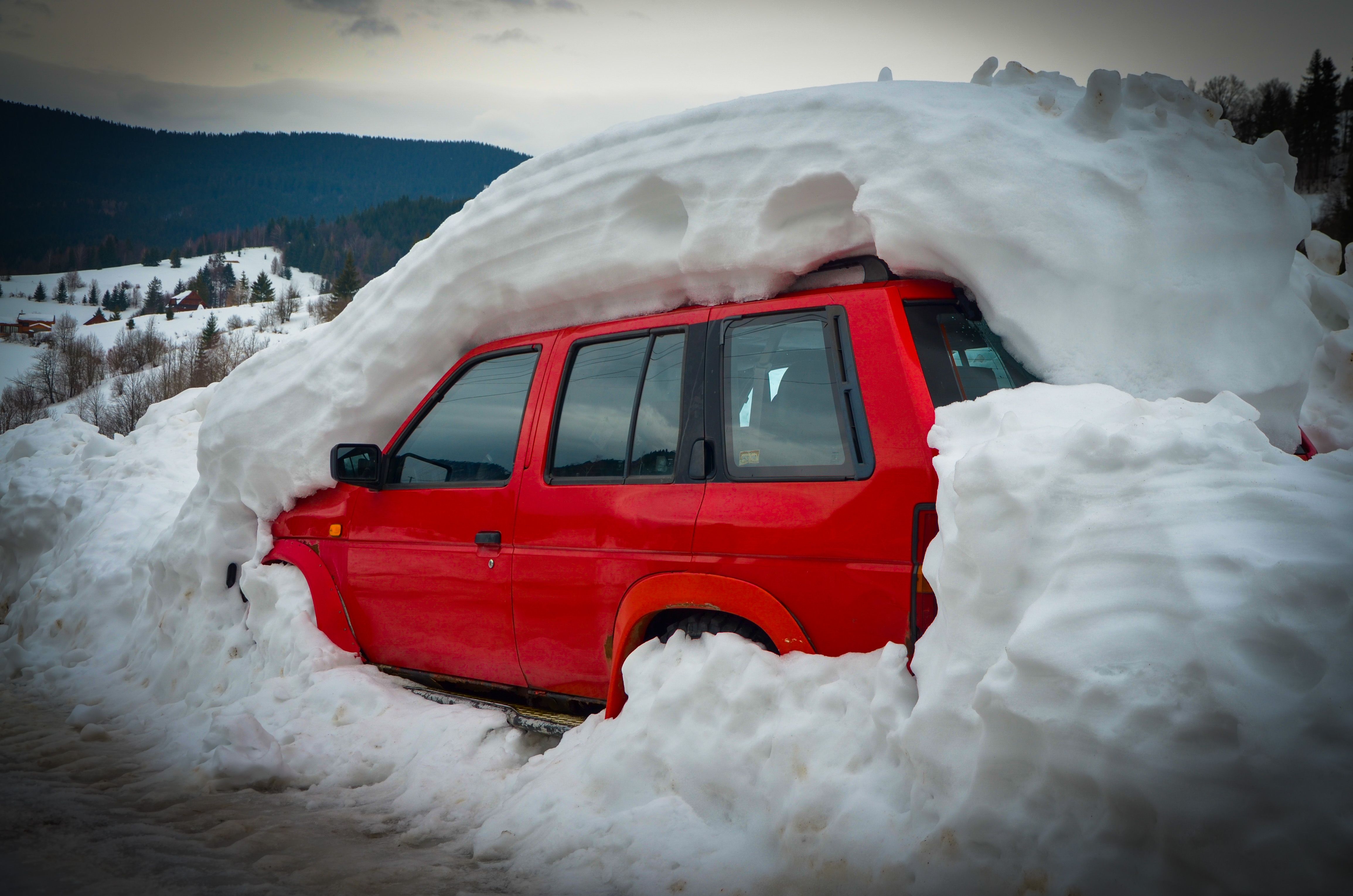 Vehicle partially buried in avalanche slide