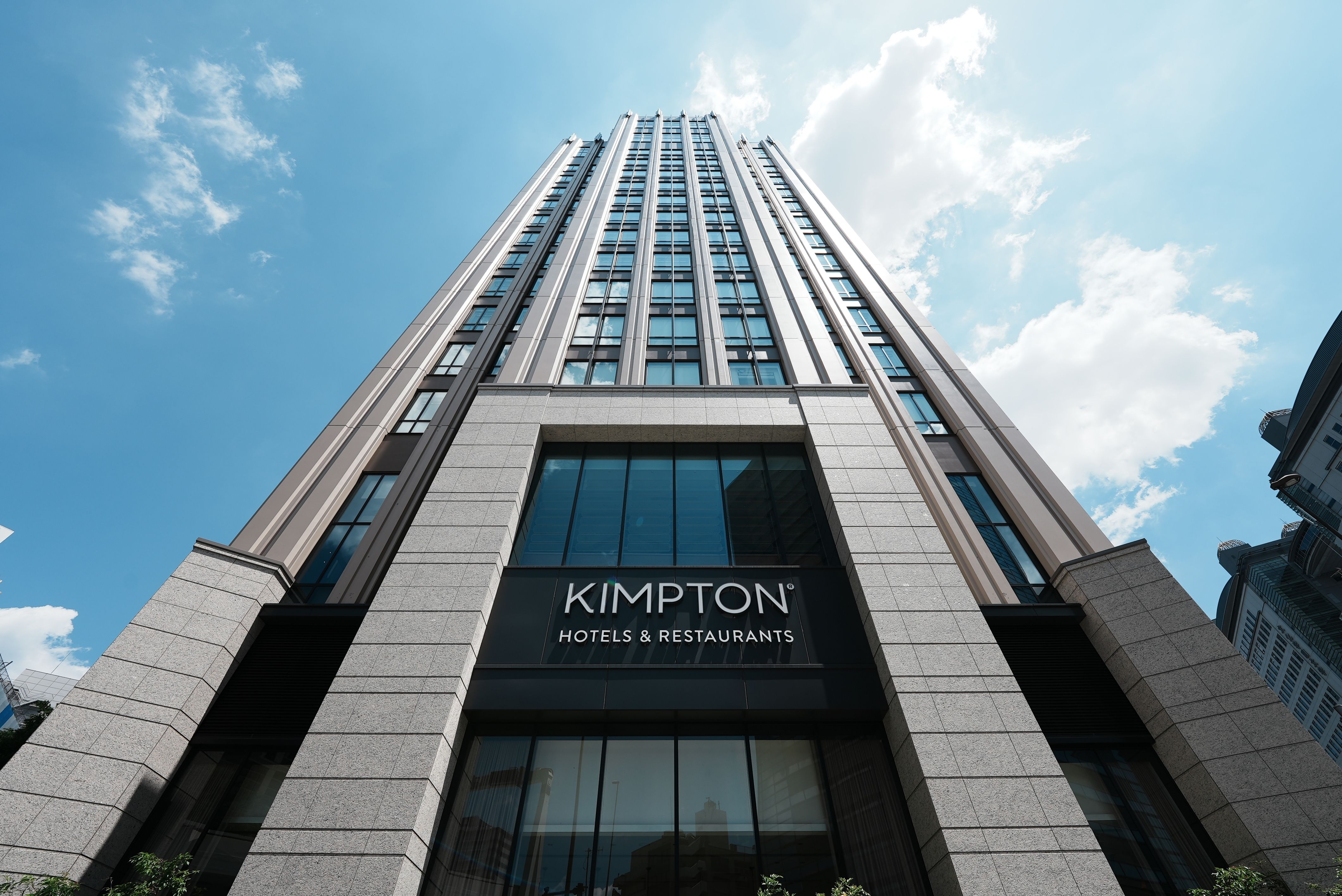 The outside of the hotel building and restaurant Kimptons