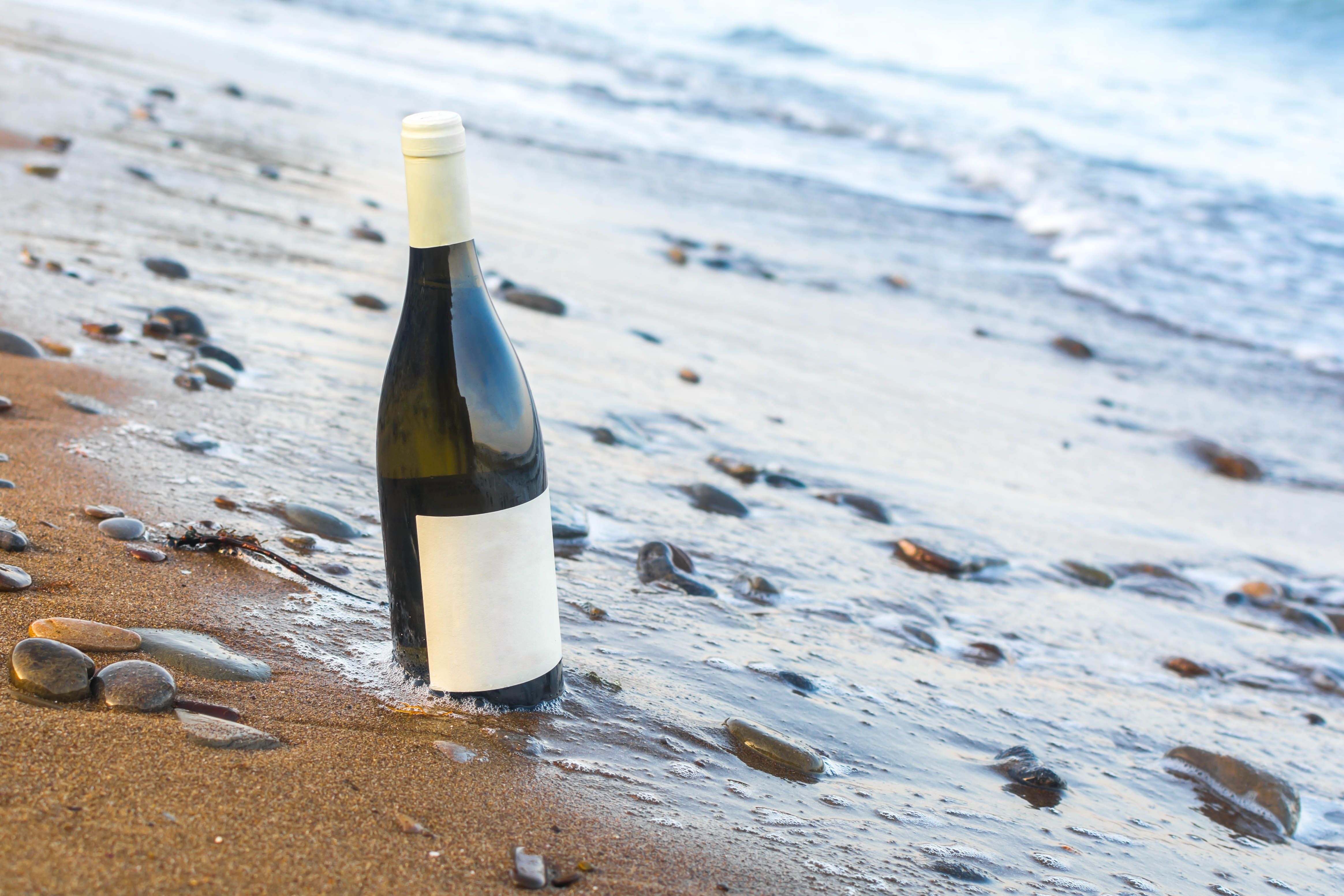A bottle of wine by the sea