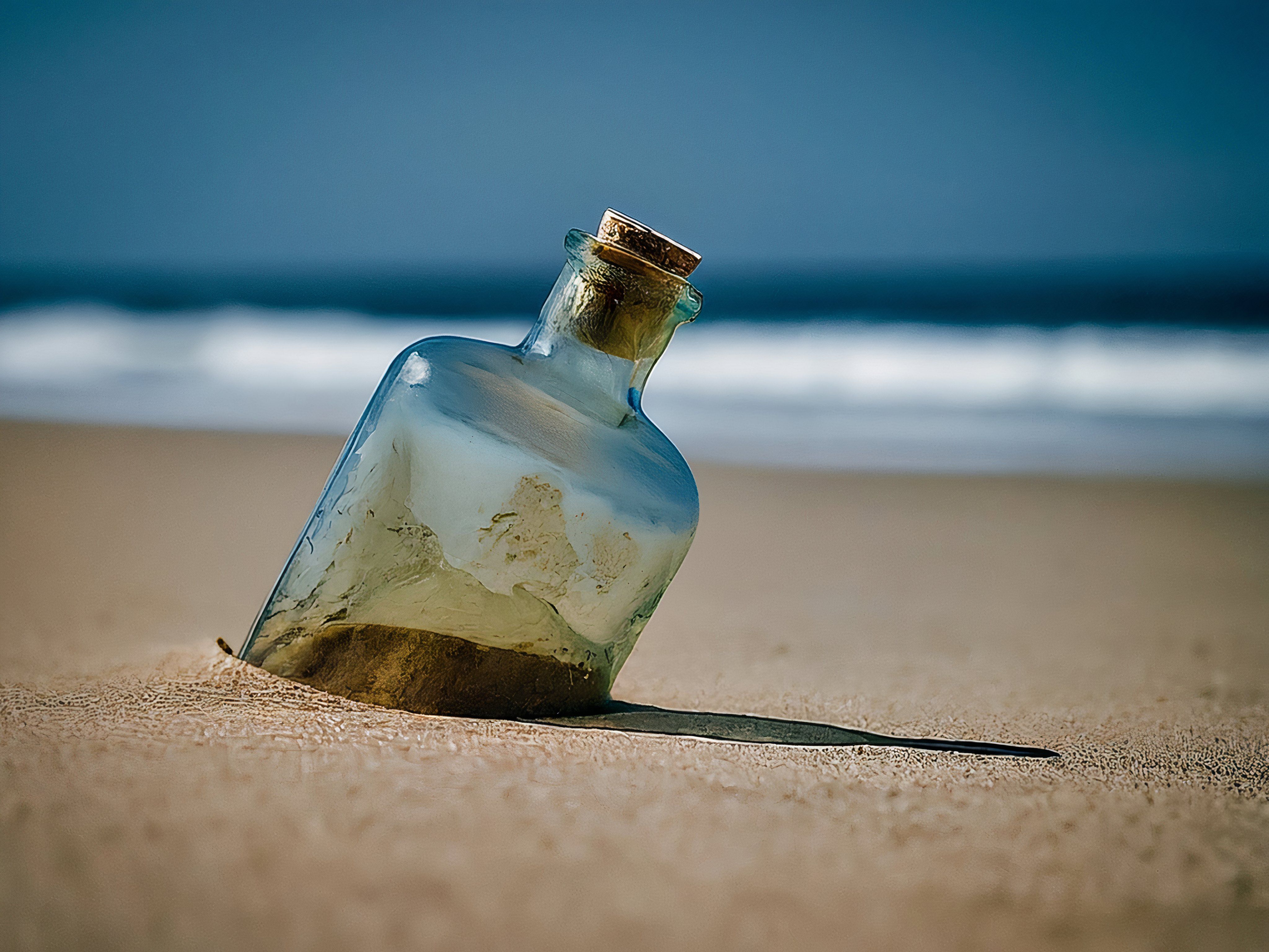 Old bottle on a sandy shore (AI generated)