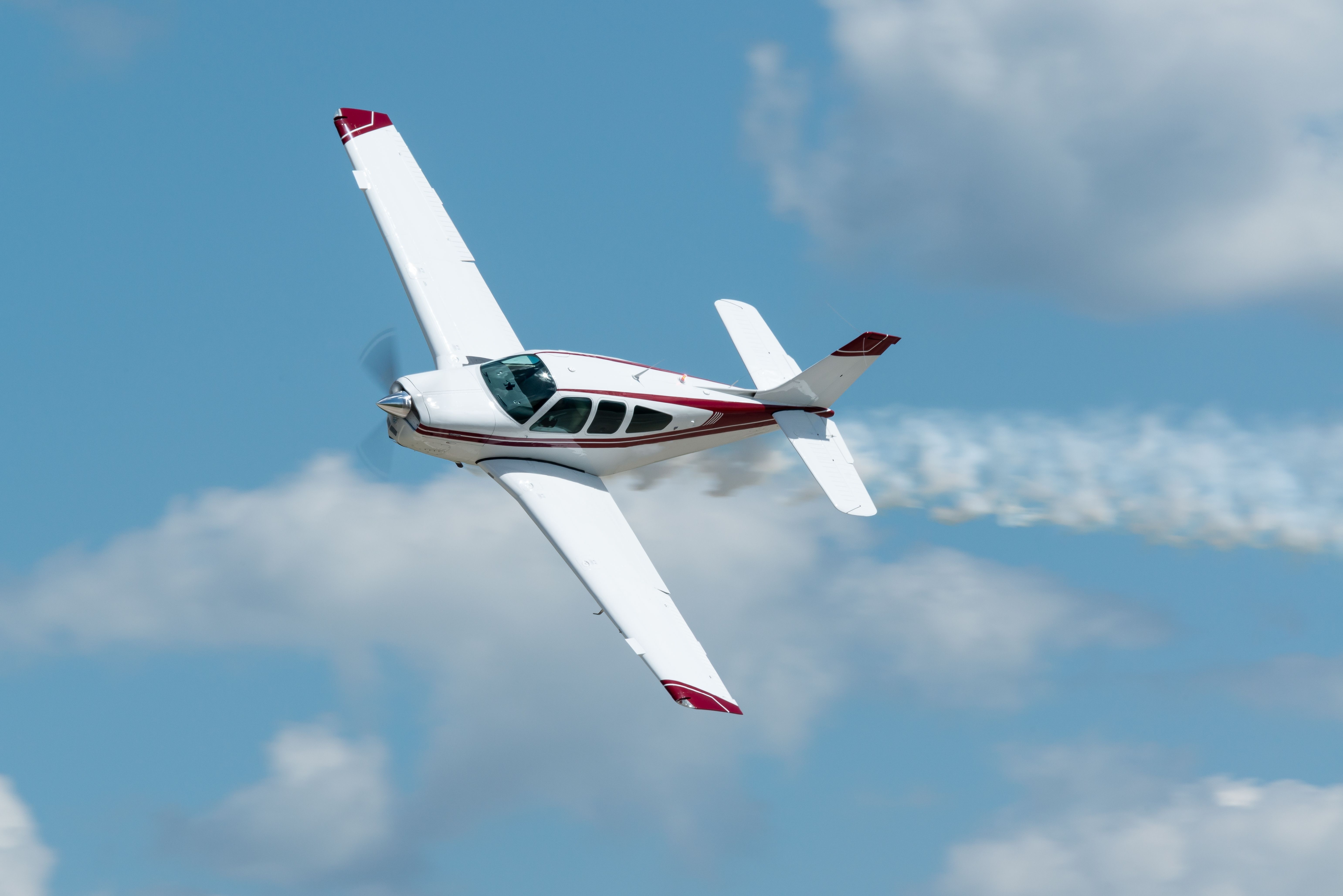 Small propeller plane descending rapidly