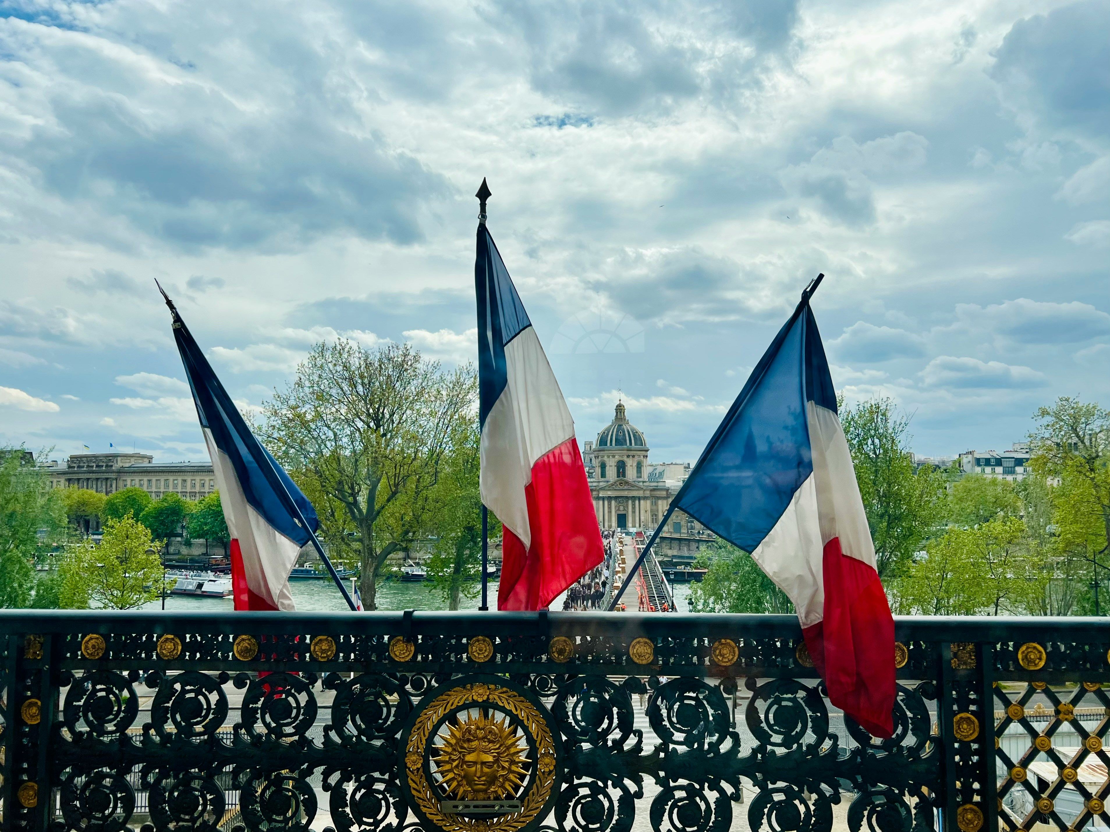 French flags are on display at the Louvre Museum in Paris, France.