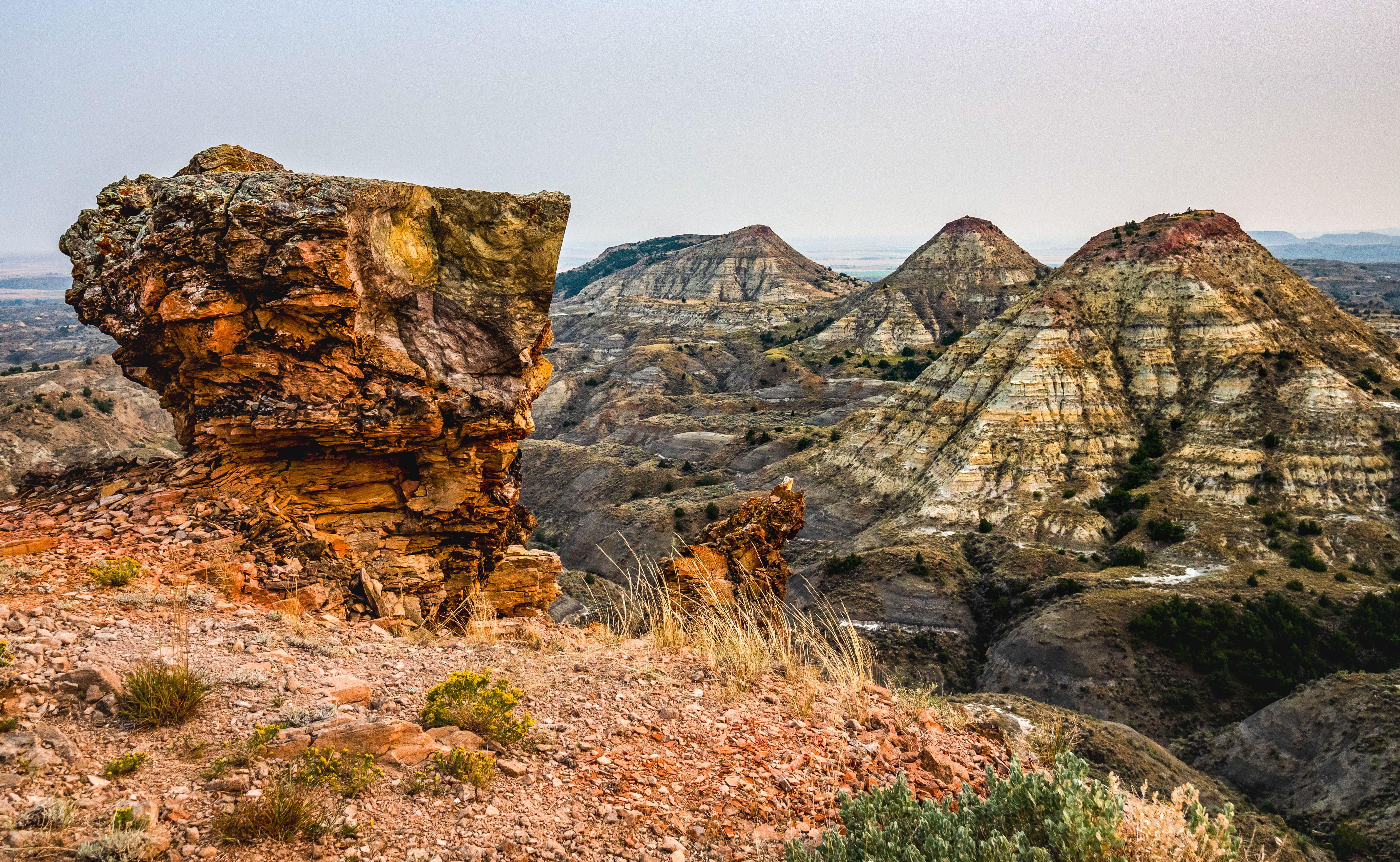 Rock Formation in Foreground with Striped Gray Mountains of Terry Badlands, Montana 
