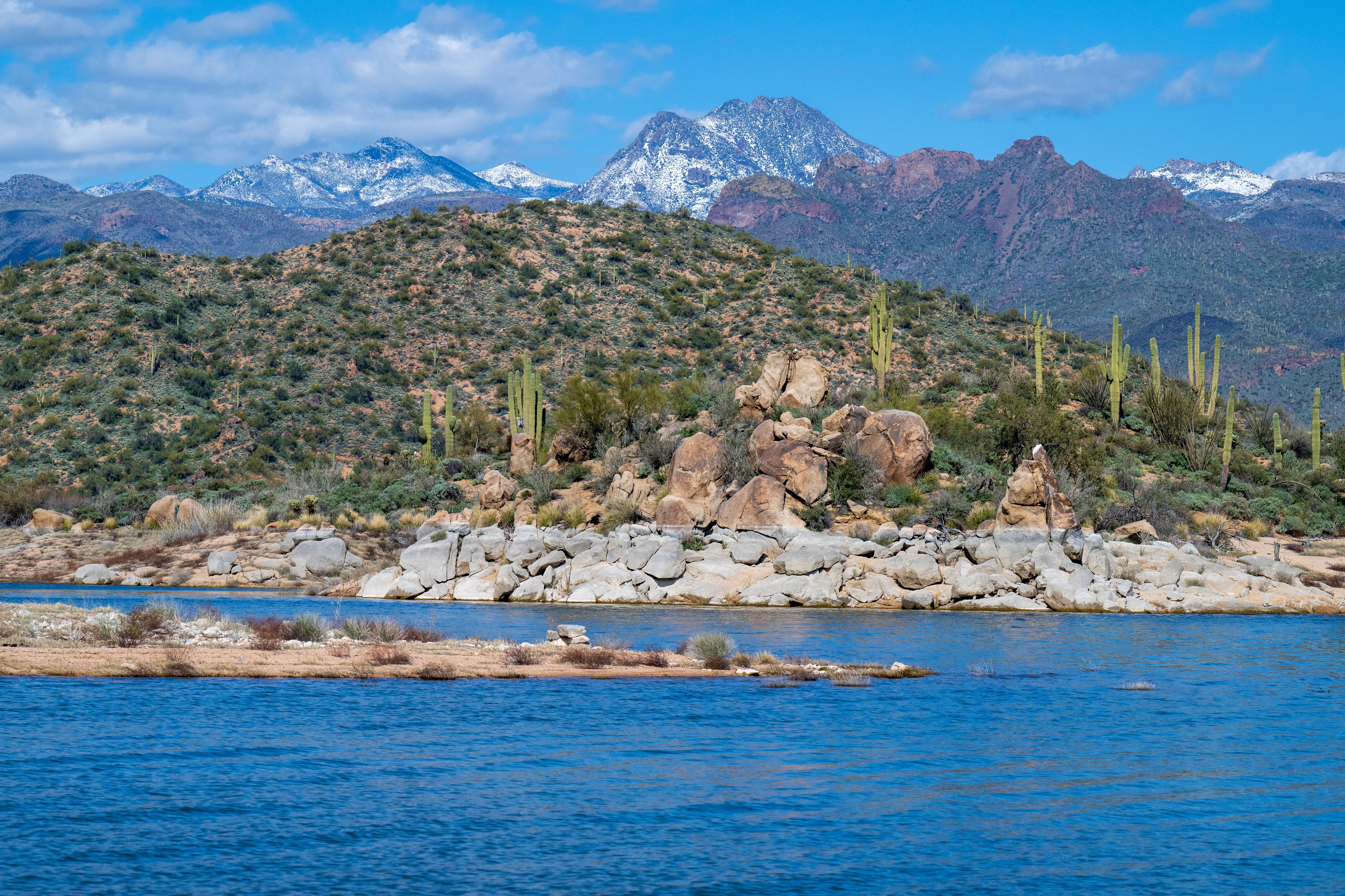 Views of the snowy mountains and desert landscape at Bartlett Lake in Arizona, AZ, USA