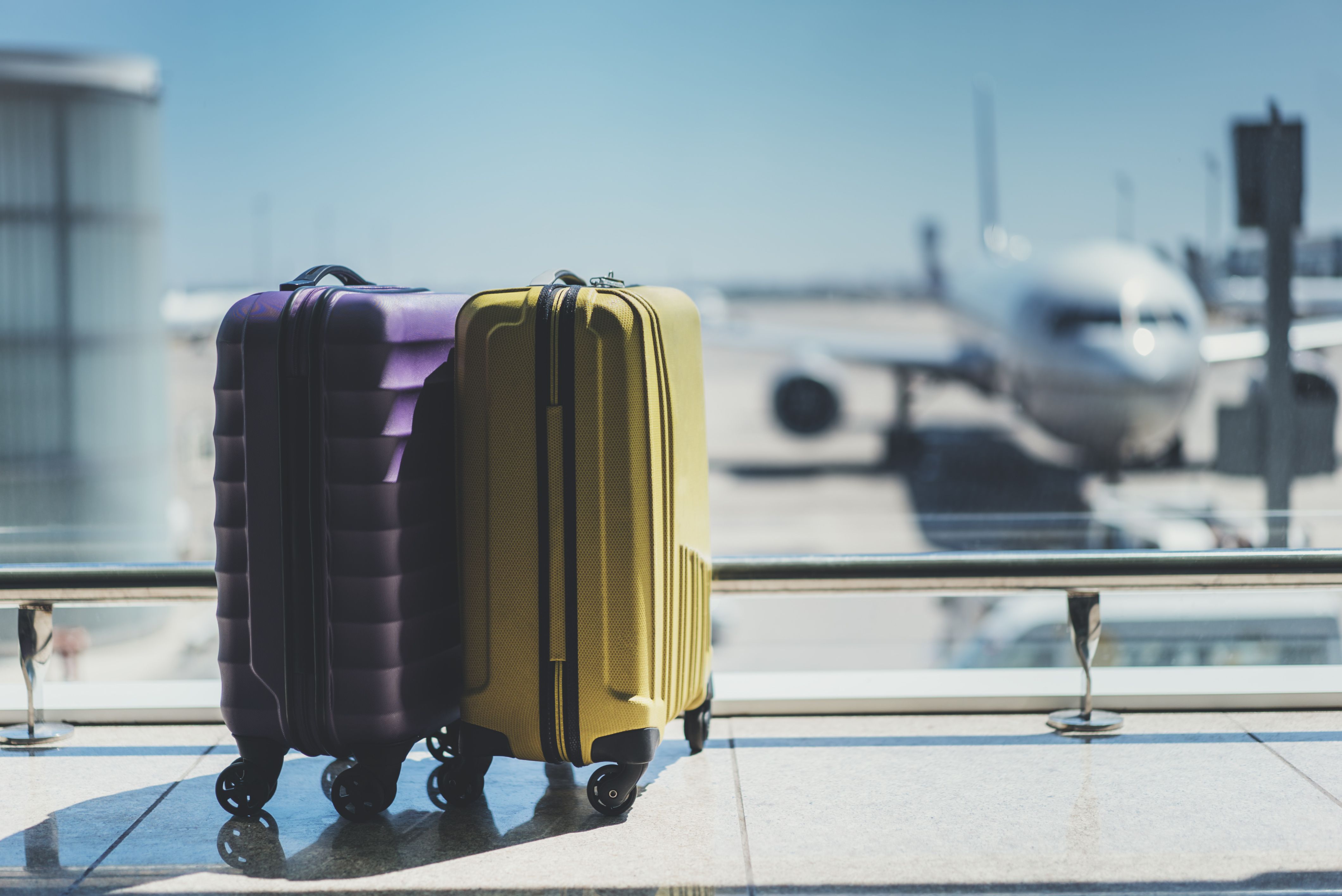 Luggage in front of a window at an airport