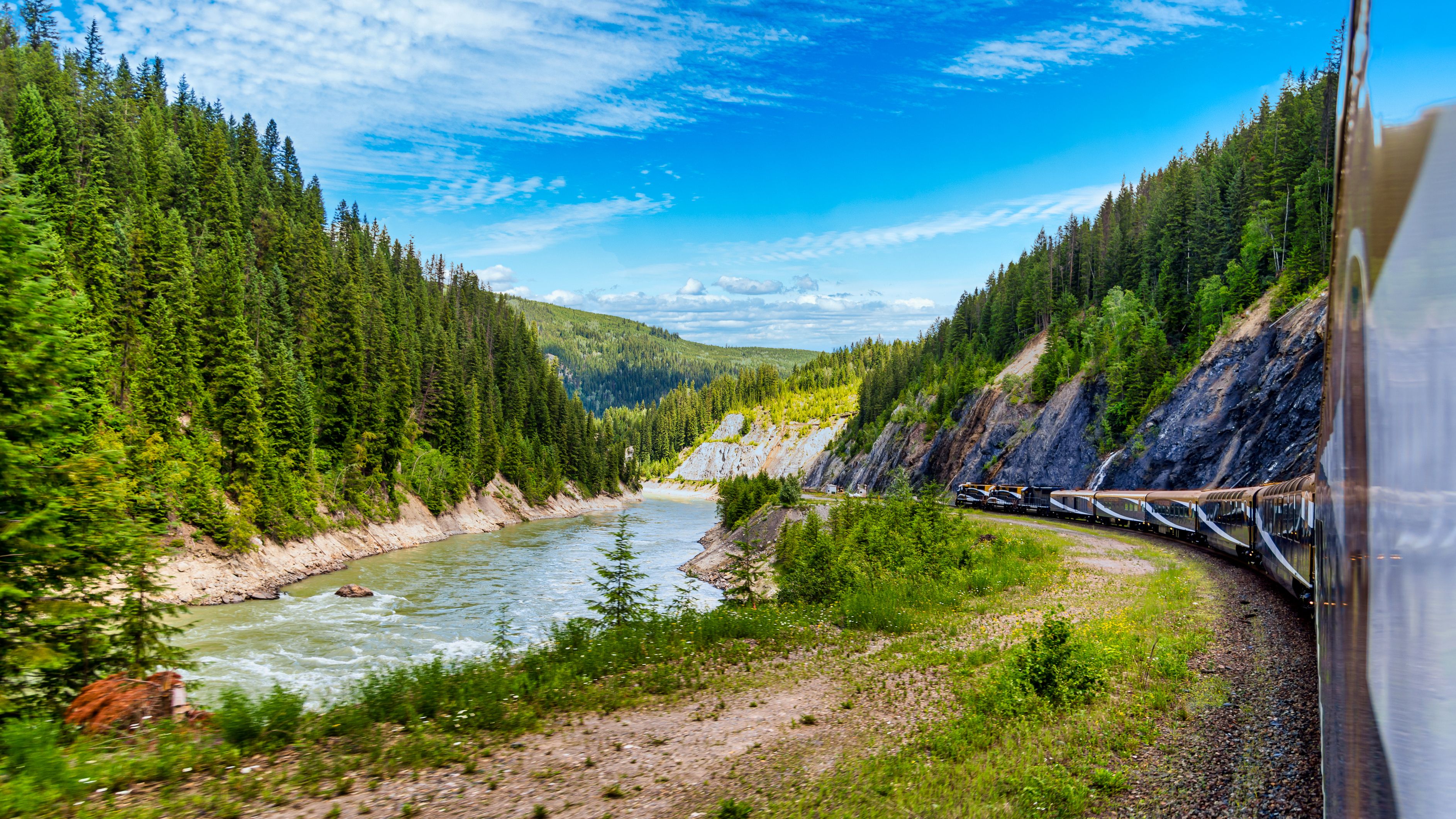 Rocky Mountaineer Train moves through the rocky mountains in Vancouver, British Columbia, Canada.