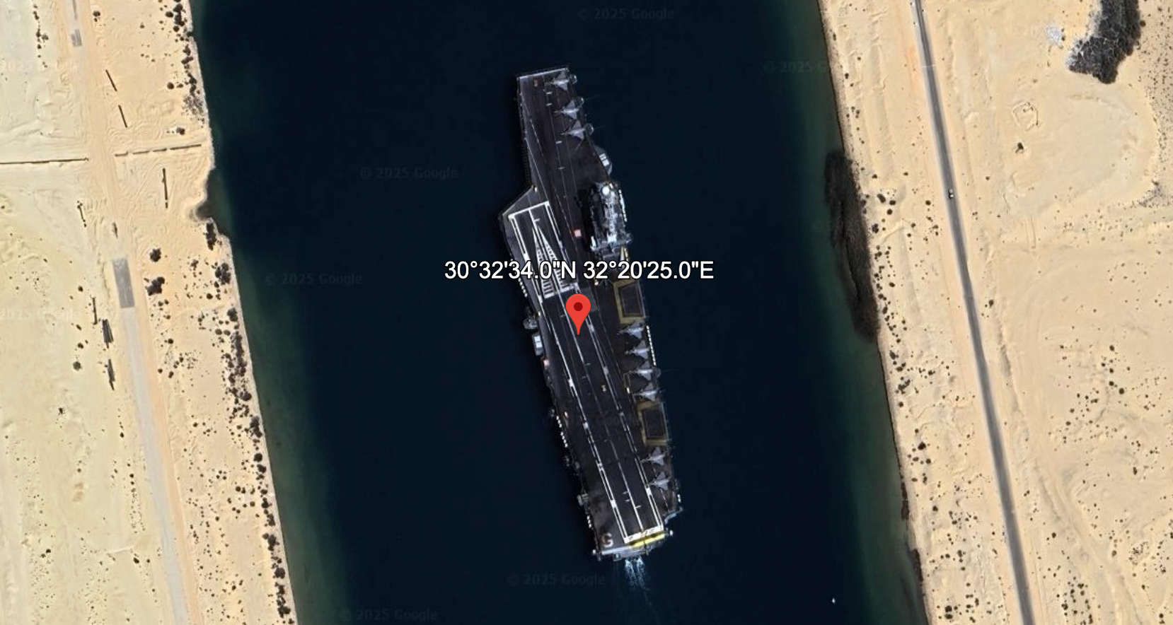 An aircraft carrier in the Suez Canal