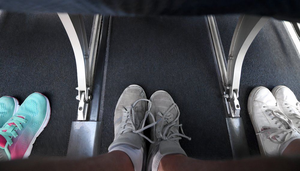 Passengers wearing sneakers on the plane