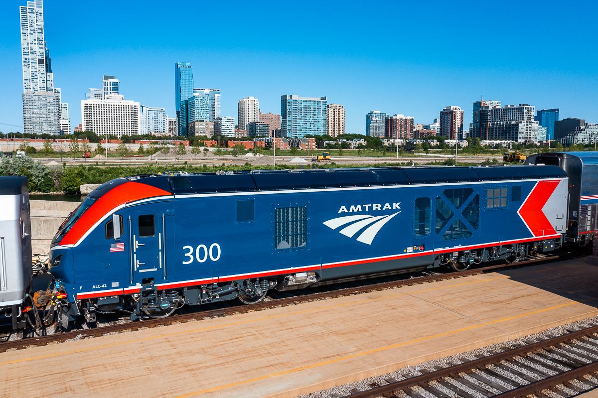 An Amtrak train stationed at a city location