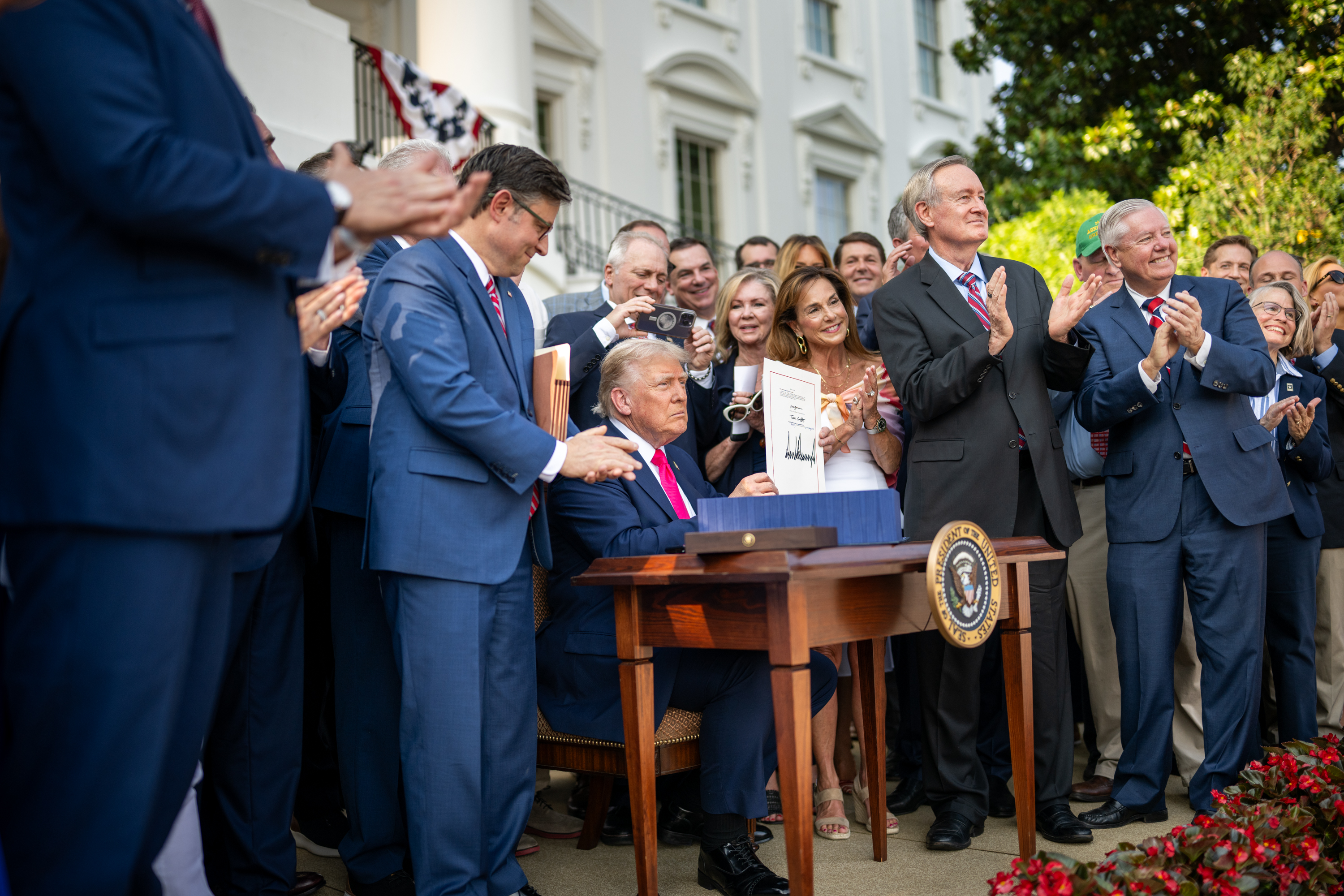 Donald Trump signs a beautiful beautiful bill in law