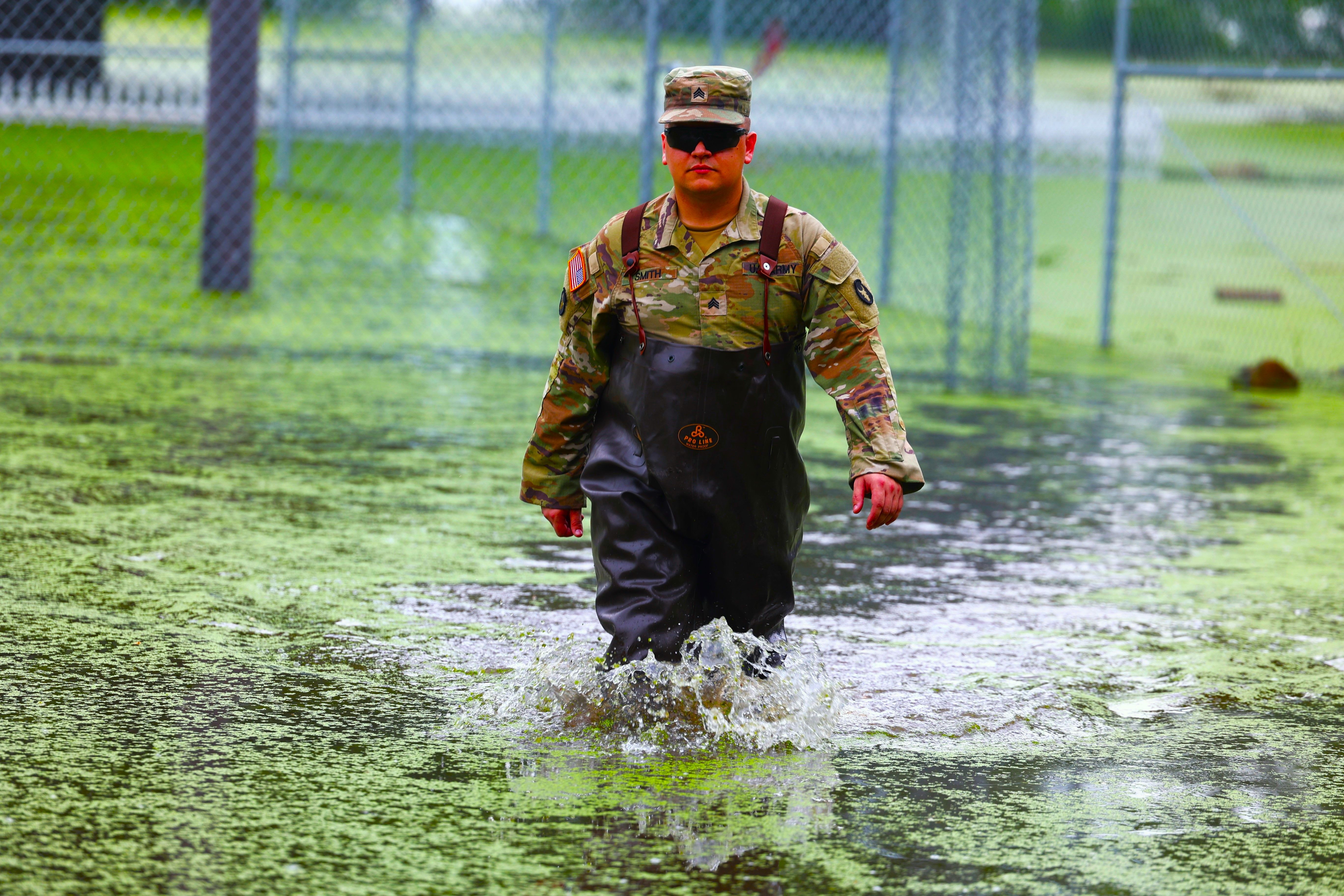 New Mexico National Guard Soldiers of the 1115th Transportation Company move sandbags to support citizens of Ruidoso, New Mexico, NM in the aftermath of fires and flash floods, which also hit the town in 2024