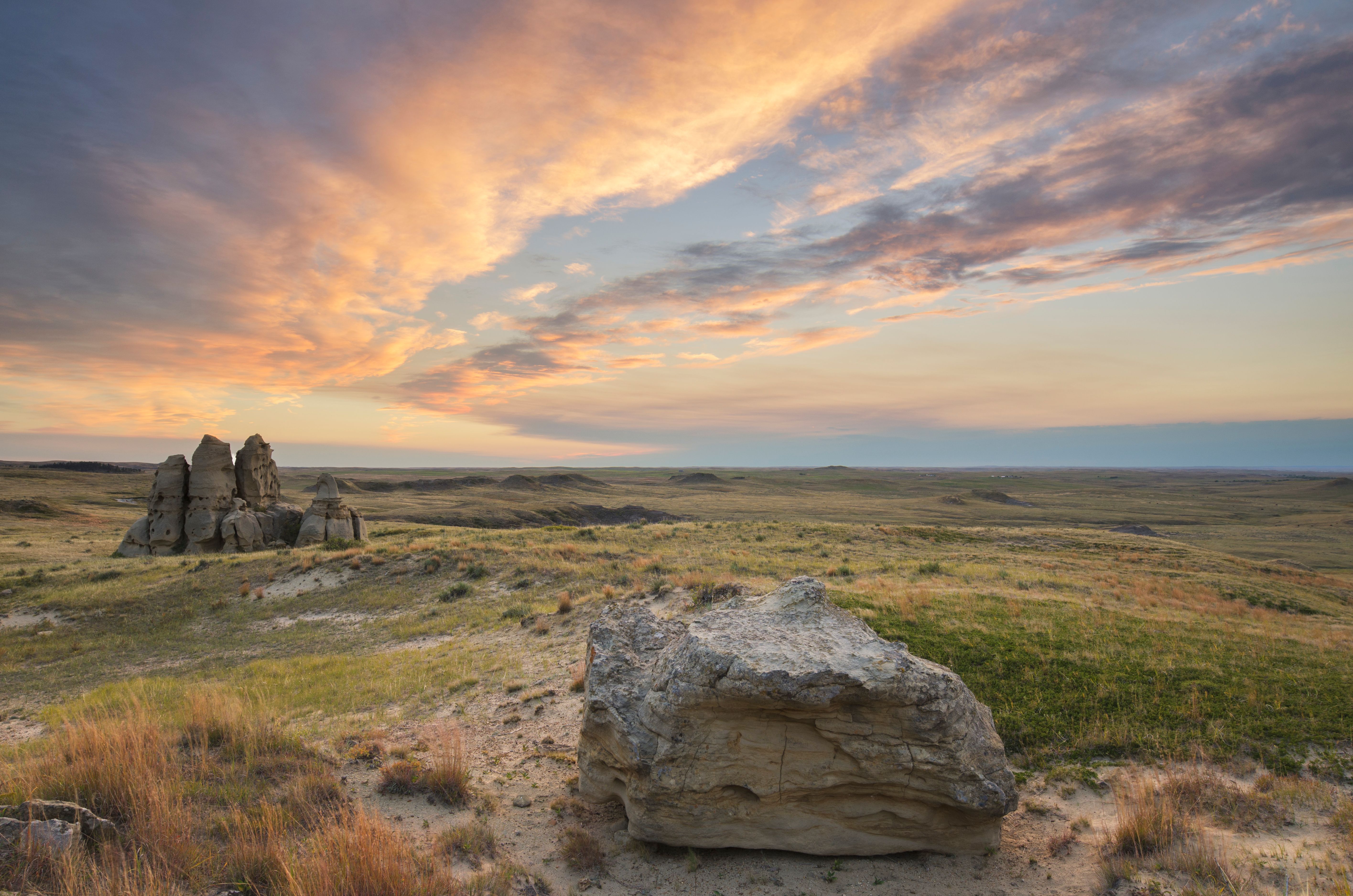 Sunset over sandstone rock formations and prairie of Medicine Rocks State Park