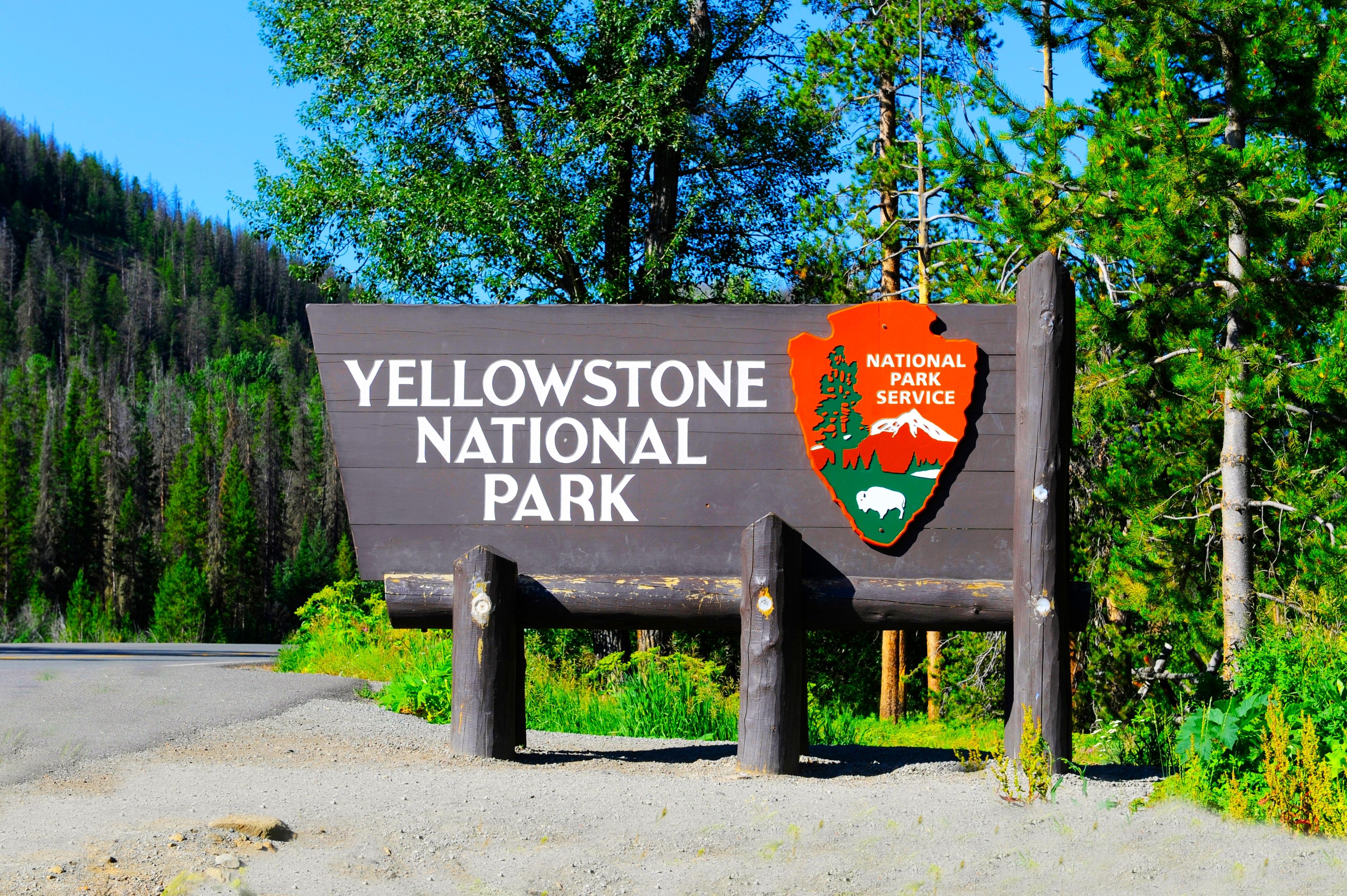 National Park Service sign and entrance to Yellowstone National Park, Wyoming, USA