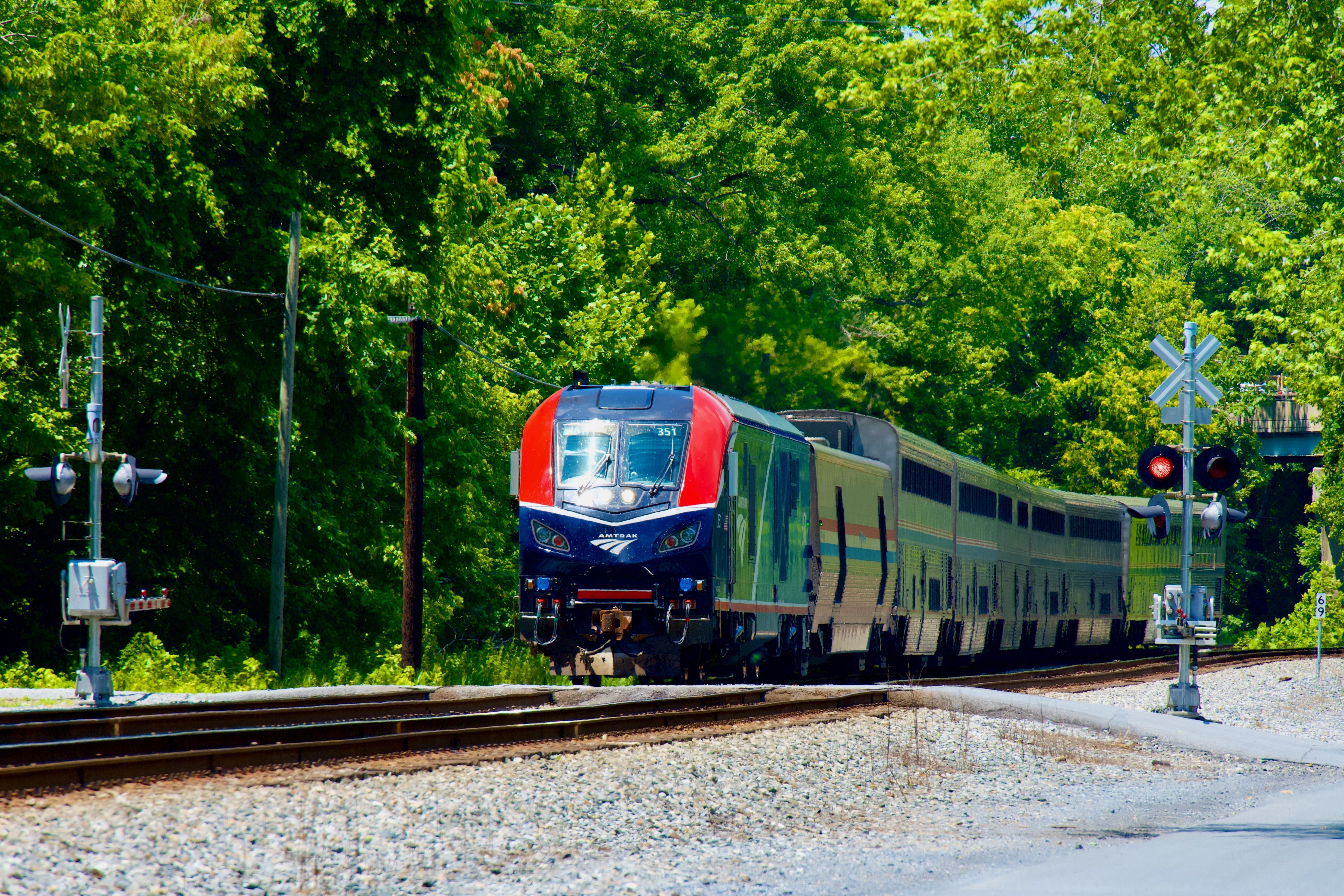 Amtrak’s “Capitol Limited” train passing through Point of Rocks at a railroad crossing on its way to Washington, D.C., USA