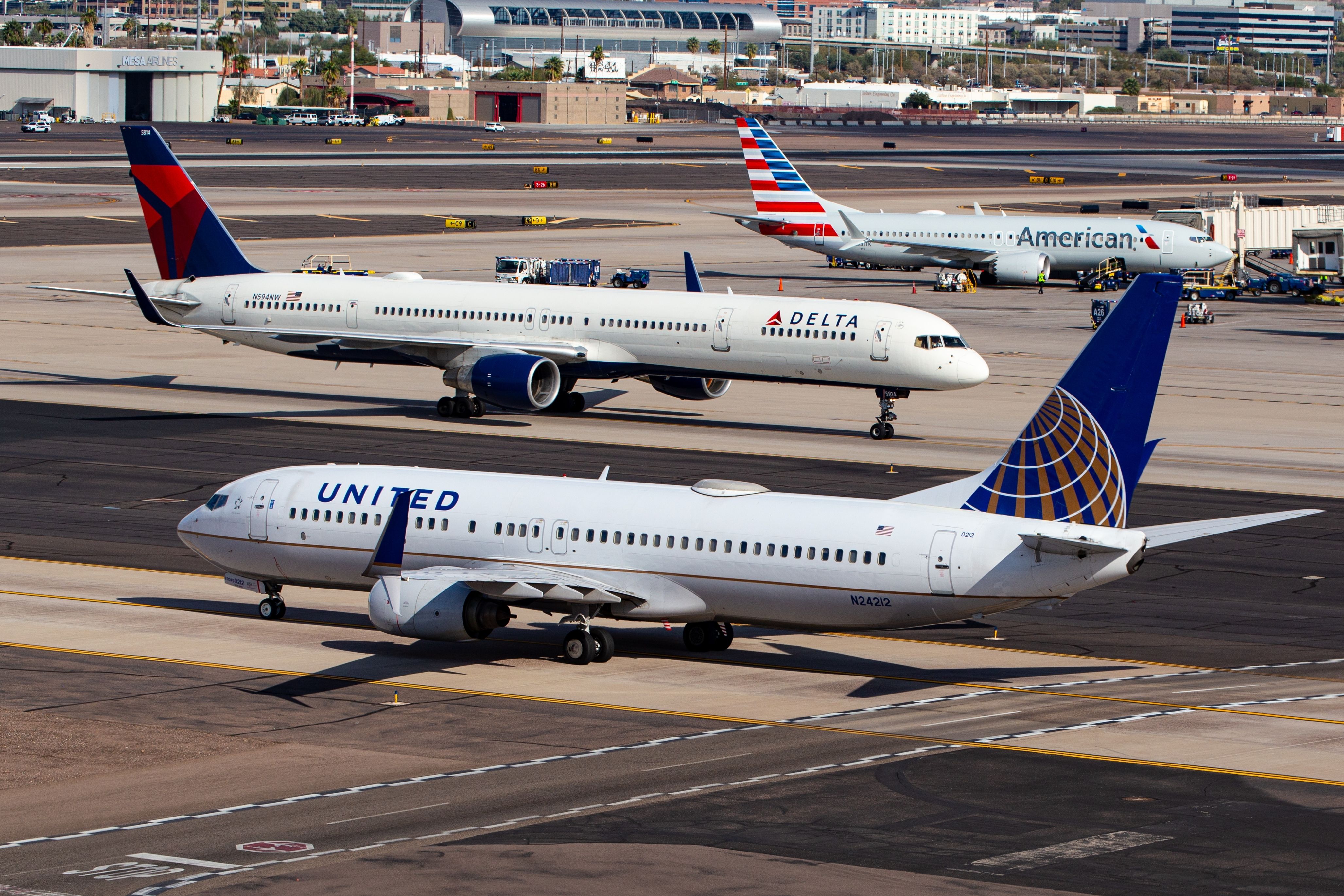 View of United, Delta, and American Airlines passenger planes at Phoenix Sky Harbor International Airport, Phoenix, Arizona, AZ, USA