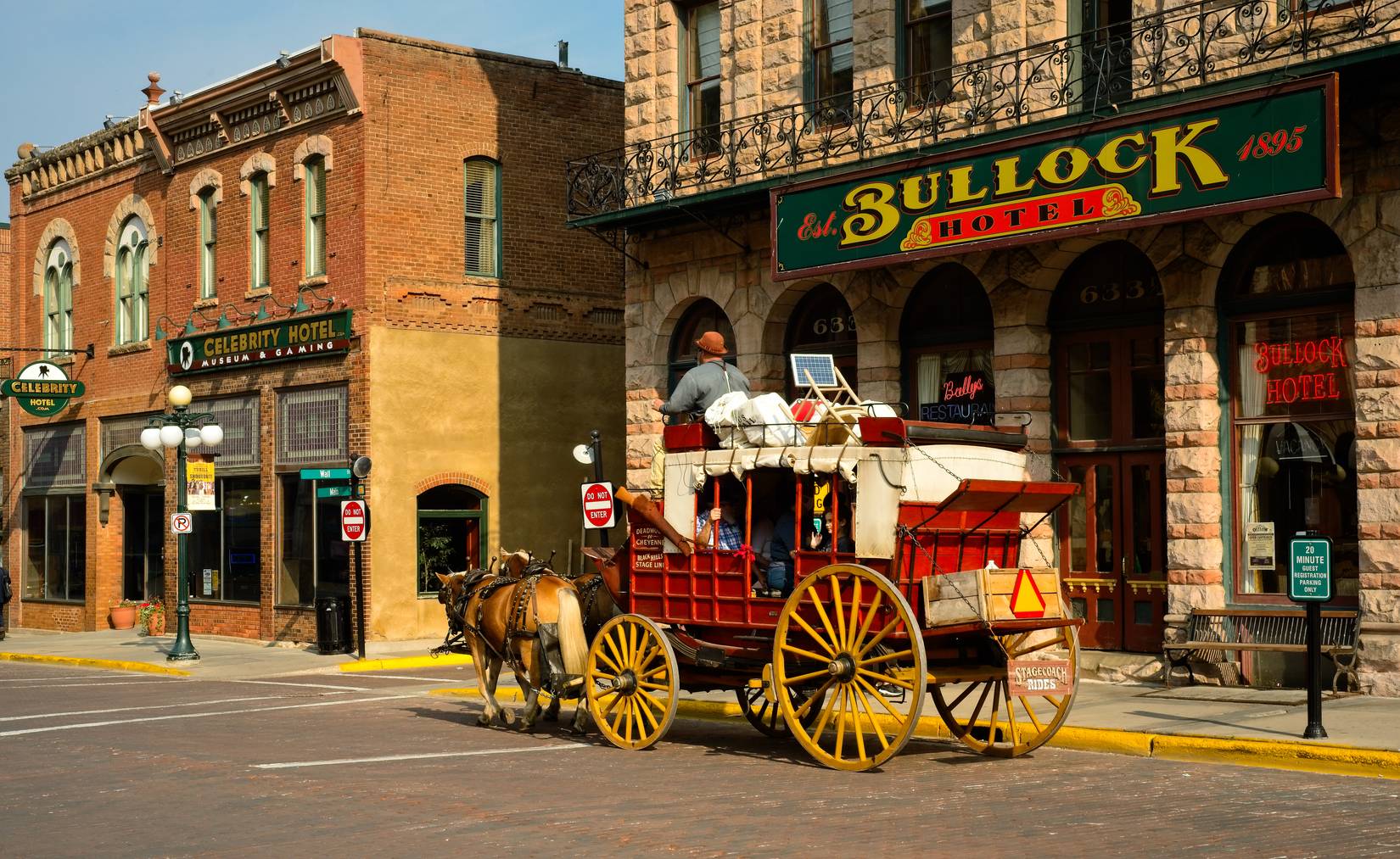 Stagecoach carries tourists past the old Bullock Hotel on Main St. in Deadwood, South Dakota